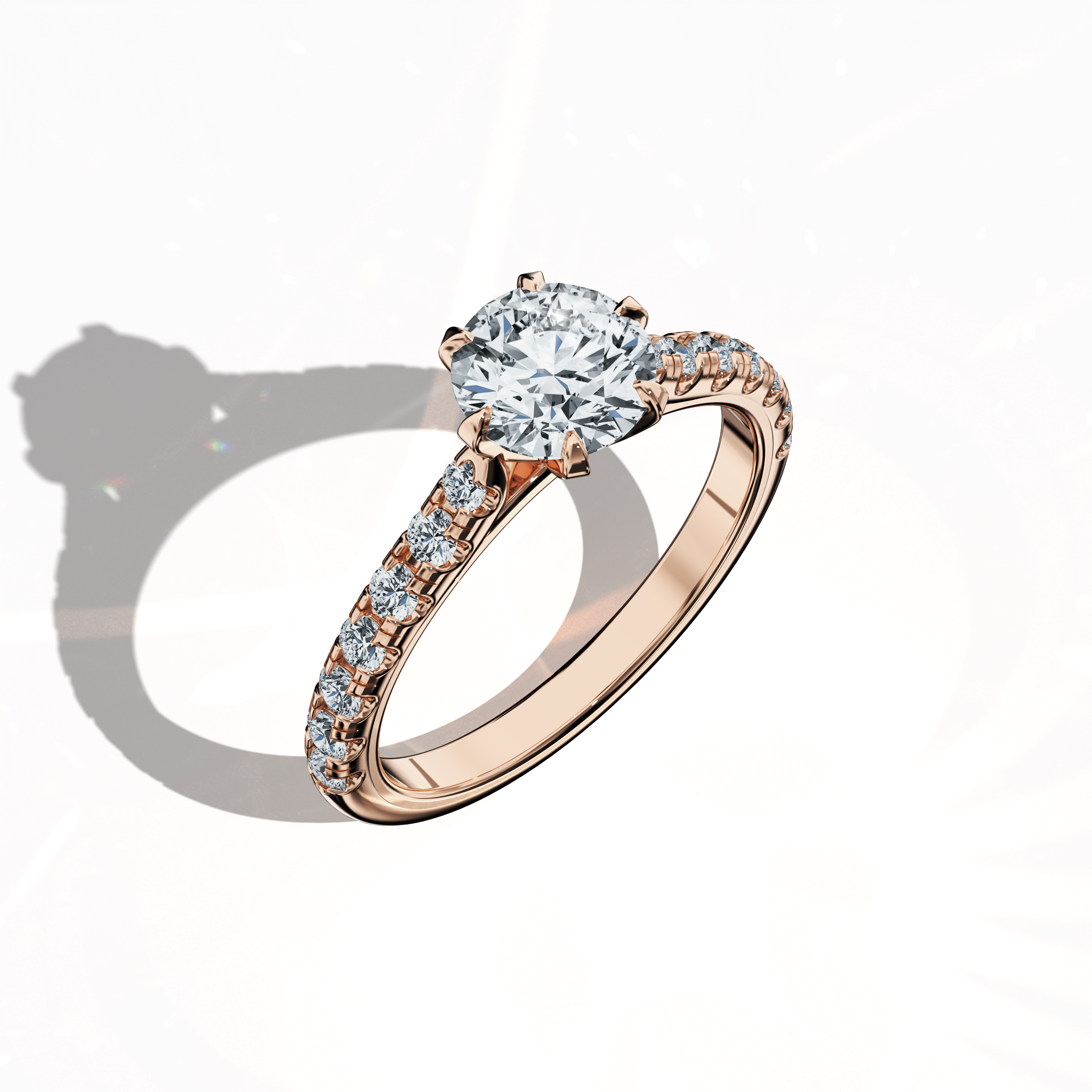 Front top side view of a розовое золото solitaire paved кольцо with a total of 1.21 ct бриллиант weight, featuring a 1 ct center/centre бриллиант and 0.21 ct side бриллианты in a slender бриллиант slim band with a four nail prong design. This dynamic view reveals detailed craftsmanship and a soft blush finish, perfect for an engagement кольцо, bridal jewelry/jewellery, or fine jewelry/fine jewellery piece. Keywords: розовое золото, paved кольцо, бриллиант slim band, luxury, 1.21 ct, detailed craftsmanship.