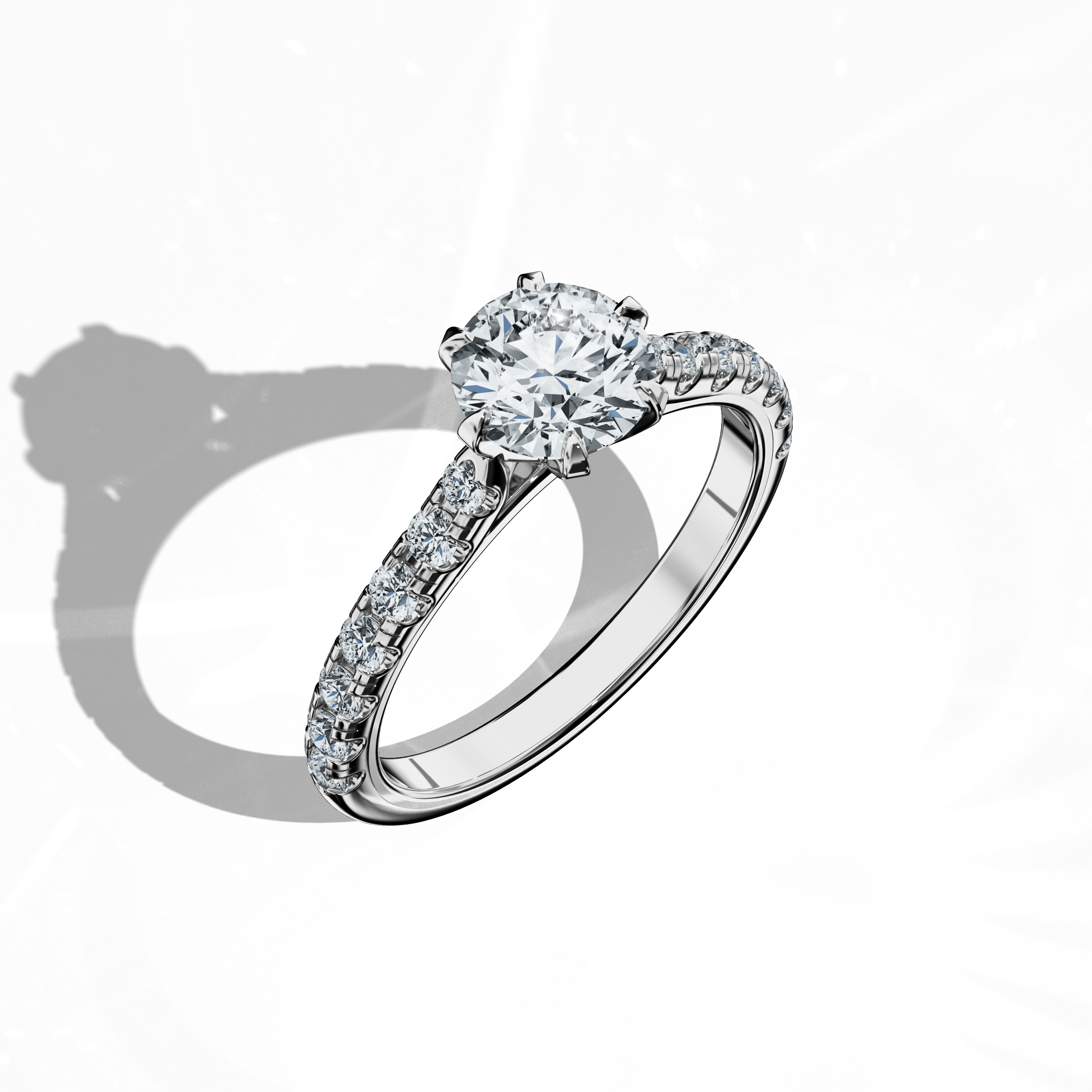 Front top side view of a белое золото solitaire paved кольцо with a total of 1.21 ct бриллиант weight, featuring a 1 ct center/centre бриллиант and 0.21 ct side бриллианты set in a slim band with a four nail prong design. This dynamic perspective reveals detailed craftsmanship and contemporary style, ideal as an engagement кольцо, bridal jewelry/jewellery, or fine jewelry/fine jewellery piece. Keywords: белое золото, paved кольцо, бриллиант slim band, luxury, 1.21 ct, detailed craftsmanship.