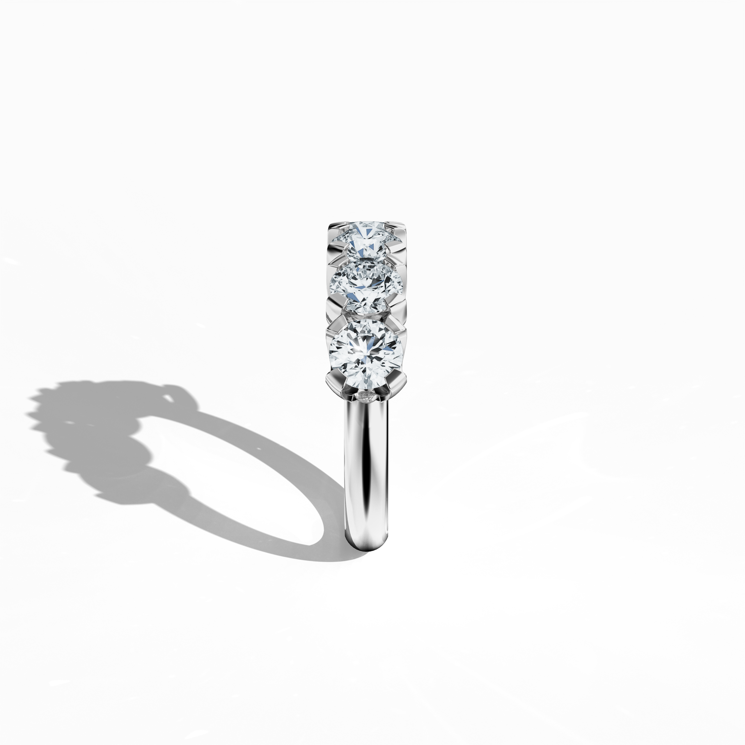 This белое золото Five Crown ring, totaling 2.50 carats with five 0.50‐carat diamonds held by four prongs, is presented in a striking standing side view. The angle accentuates its sleek profile and the intricate detail of the polished band. Reflecting varied Украшения language—ring, band, Ювелирные изделия, and ornament—it is also termed Five Crown Ring, Five Stone Ring, Quintet Diamond Ring, Five Gem Ring, Crowned Five Ring, and Penta Stone Ring. Keywords: elegance, brilliance, luxury.