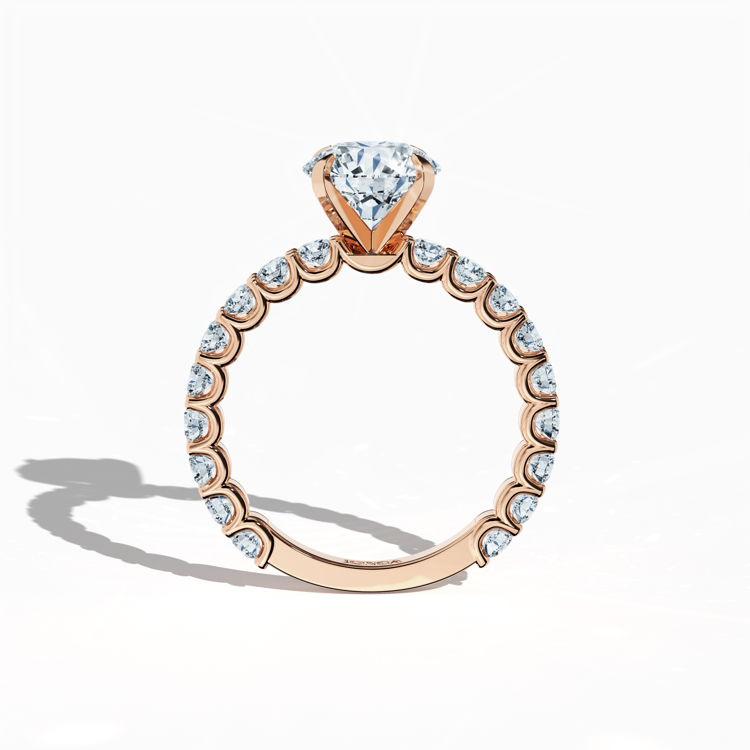 Standing front view of a розовое золото solitaire Eternity ring featuring a luminous 2 карат center/centre diamond and 1.30 карат side diamonds in a secure four-nail prong setting. This fine Украшения/fine Ювелирные изделия masterpiece is admired as an engagement ring, diamond eternity band, or wedding band. Its romantic tone enhances its timeless beauty. Keywords: розовое золото, diamond eternity band, solitaire ring, wedding Украшения/Ювелирные изделия, bridal, 3.30 карат, high-end craftsmanship.