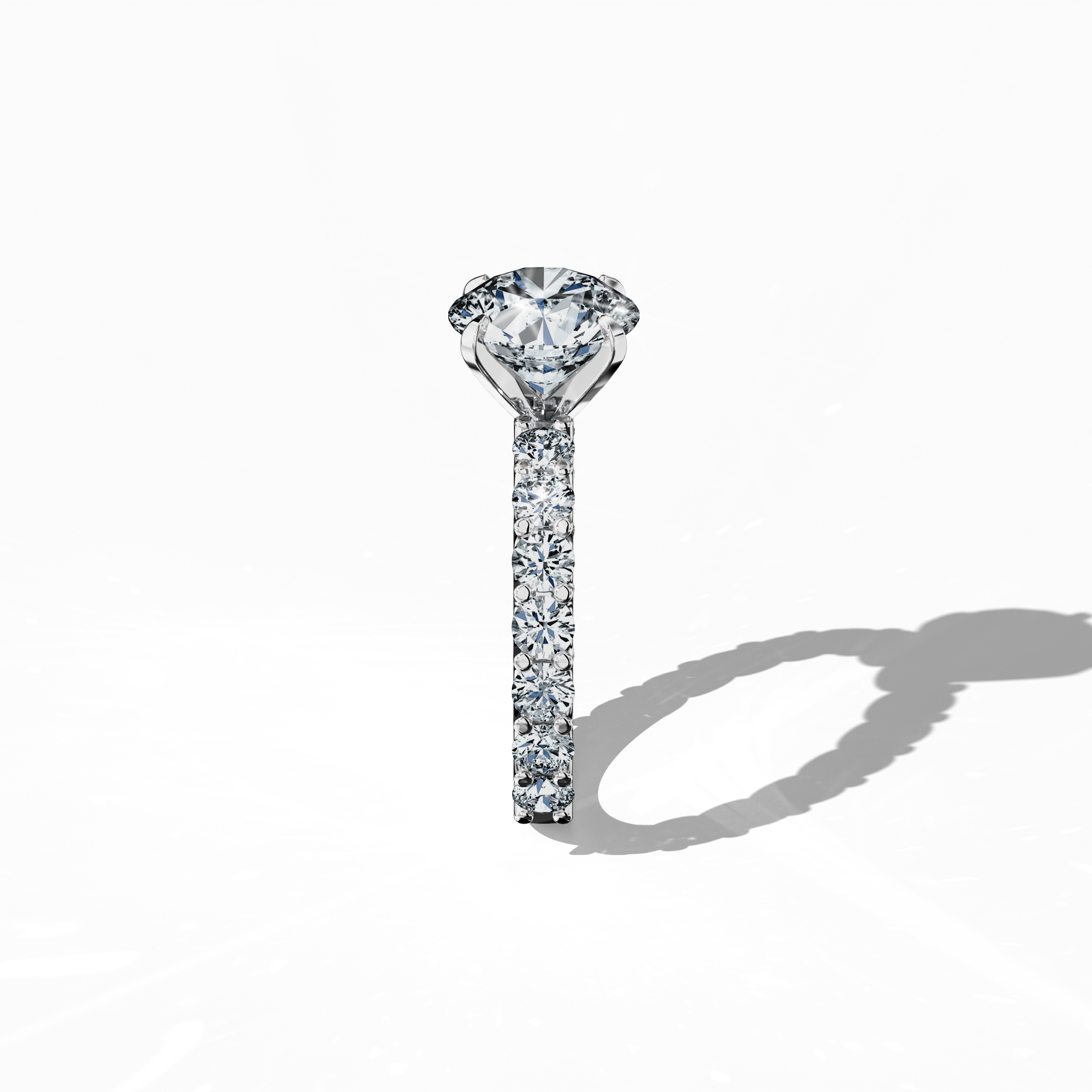Side profile of a белое золото solitaire Eternity ring with a stunning 3 карат center/centre diamond and 1.60 карат side diamonds, all set securely in a four-nail prong setting. This elegant side view emphasizes the sleek design and sparkling diamonds, making it a coveted piece for engagements, weddings, or anniversaries. Keywords: розовое золото, solitaire, diamond eternity band, luxury ring, wedding band, fine Ювелирные изделия, 4.60 карат, elegant side view.