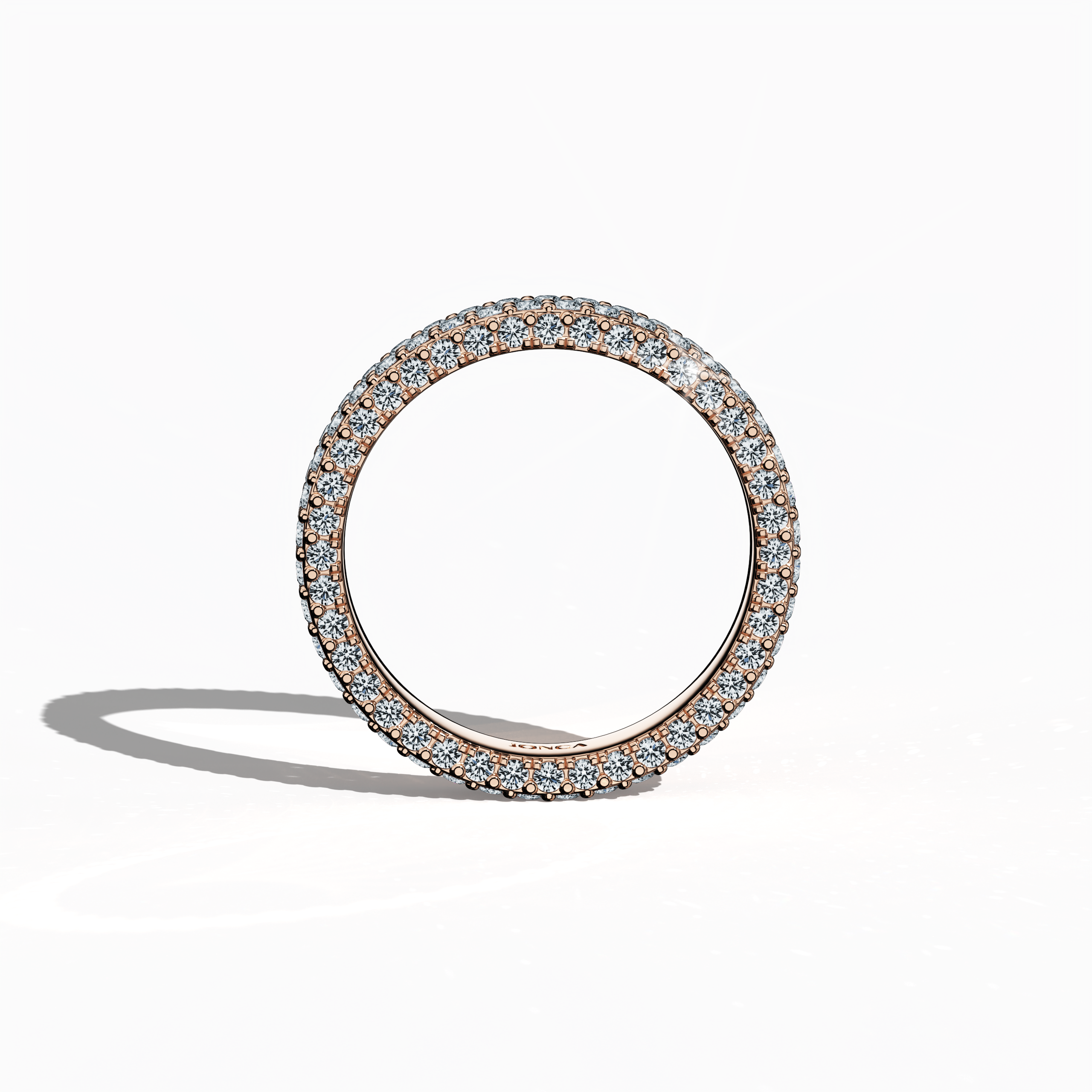 Charming розовое золото 4-row diamond band captured in a standing front view, emphasizing up to 2.10 carats of artfully arranged micro diamonds. This distinctive design, also called an eternity band, classic pave band, multi-row diamond band, and refined diamond band across diverse markets, radiates a lustrous blush gold finish with intricate engravings and balanced lines. The image conveys modern allure and timeless elegance with a graceful poise. Keywords: розовое золото, micro diamonds, chic, luxury.