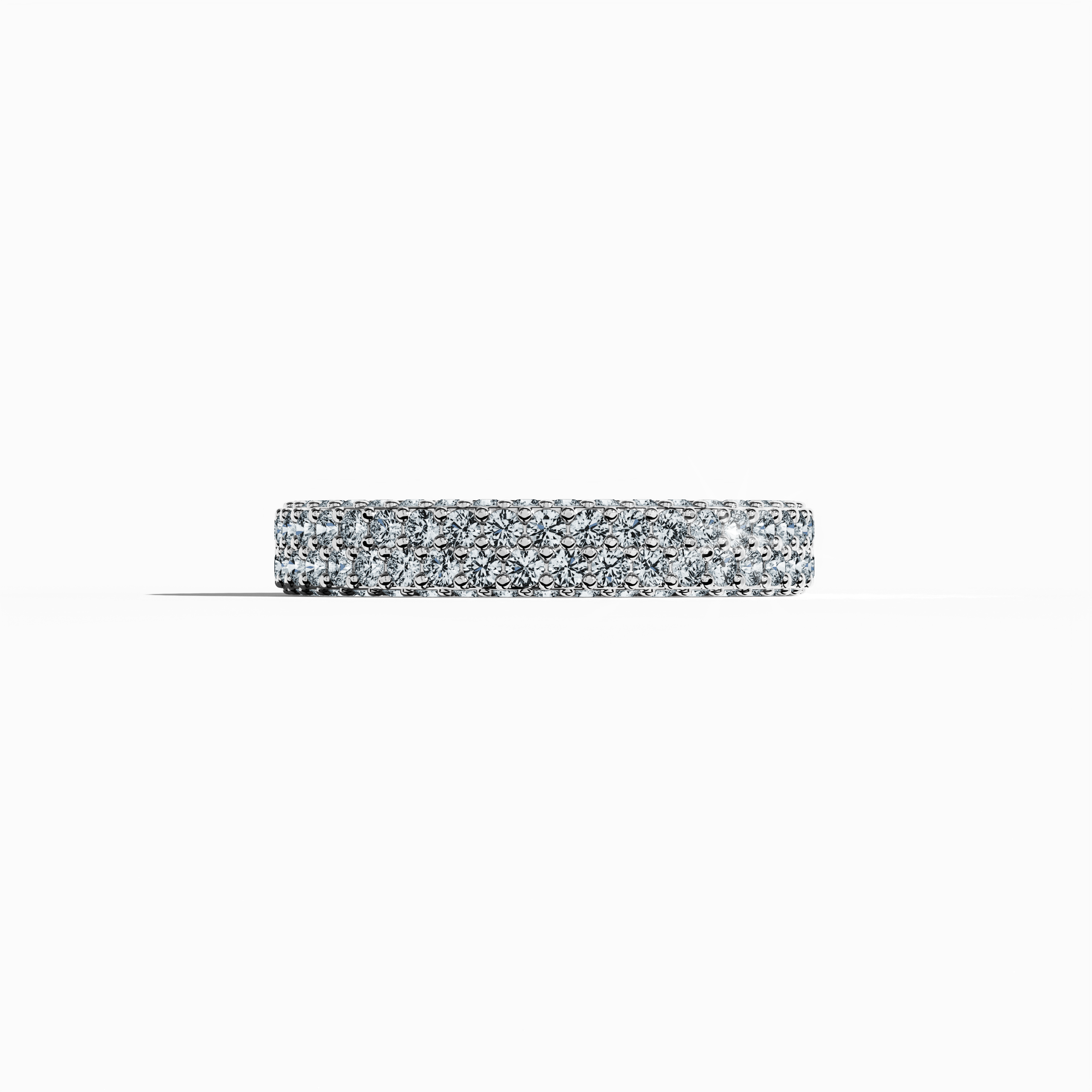 "Elegant белое золото 4-row diamond band in a sleeping front view, showcasing up to 2.10 carats of meticulously set micro diamonds. This refined design, known globally as an eternity band, classic pave band, multi-row diamond band, and stacked diamond band, radiates an icy gold brilliance with subtle engravings and harmonious contours. The image exudes modern luxury and timeless sophistication with delicate reflections. Keywords: белое золото, micro diamonds, luxury, elegance, refined design.