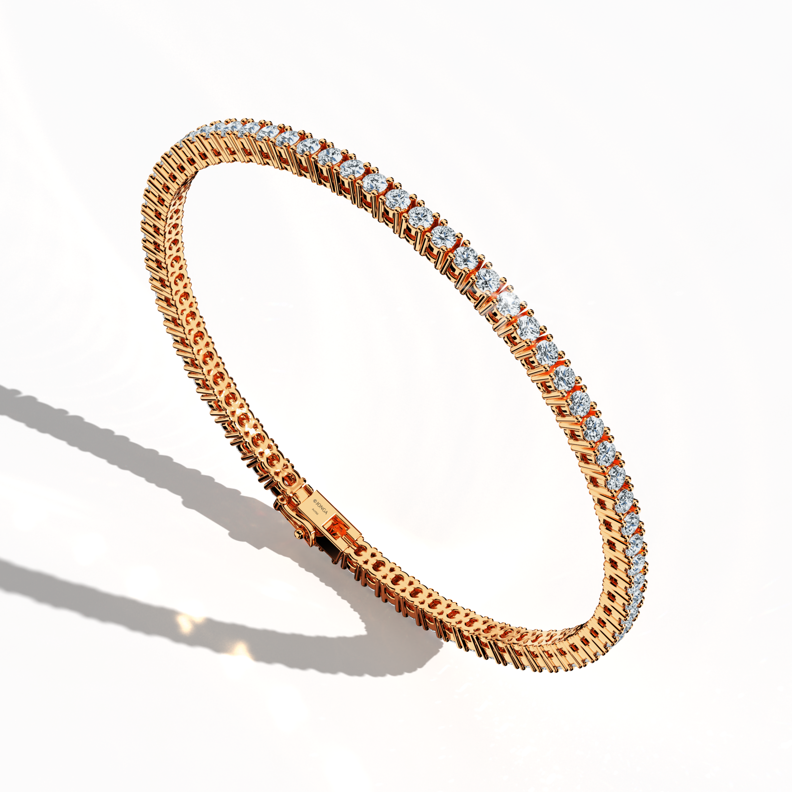 In a standing front top side view, this 4 carat diamond tennis bracelet in rose gold (alternatively called pink gold or red gold) displays a gracefully arched band featuring prong-set round brilliant diamonds. Also known as a tennis bracelet, line bracelet, eternity bracelet, river bracelet, or inline bracelet, its sophisticated four‐prong design highlights each diamond’s captivating fire, making it an exquisite choice for special occasions and upscale daily ensembles. Keywords: diamond tennis bracelet.