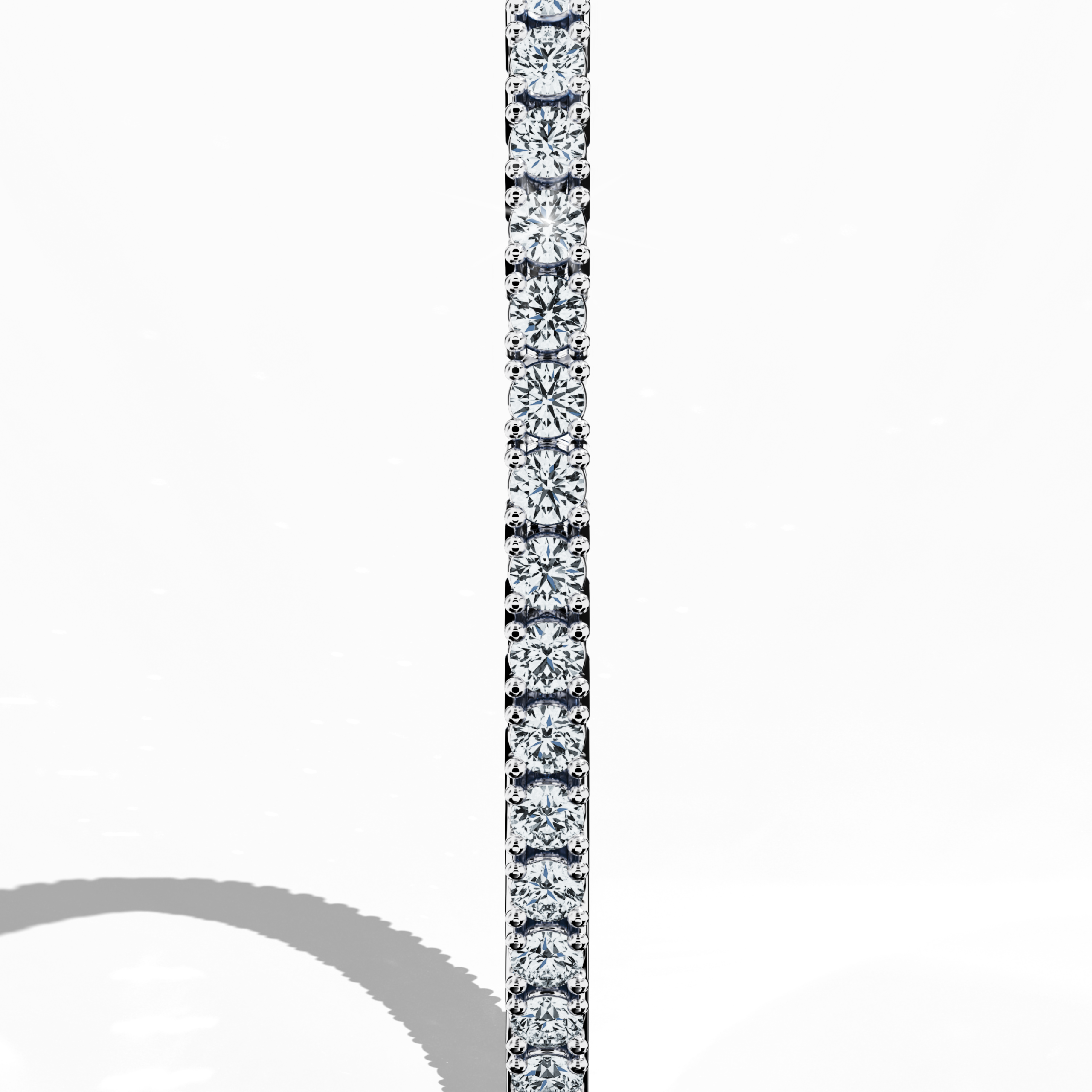 In a standing side view, this 4 carat diamond tennis bracelet in white gold (alternatively called grey gold or palladium gold) reveals a graceful profile with a seamless band of prong-set round brilliant diamonds. Also known as a tennis bracelet, line bracelet, eternity bracelet, river bracelet, or inline bracelet, its precise four‐prong design accentuates each diamond’s natural sparkle, making it ideal for upscale occasions and refined everyday wear. Keywords: diamond tennis bracelet, 4 carat, white gold,