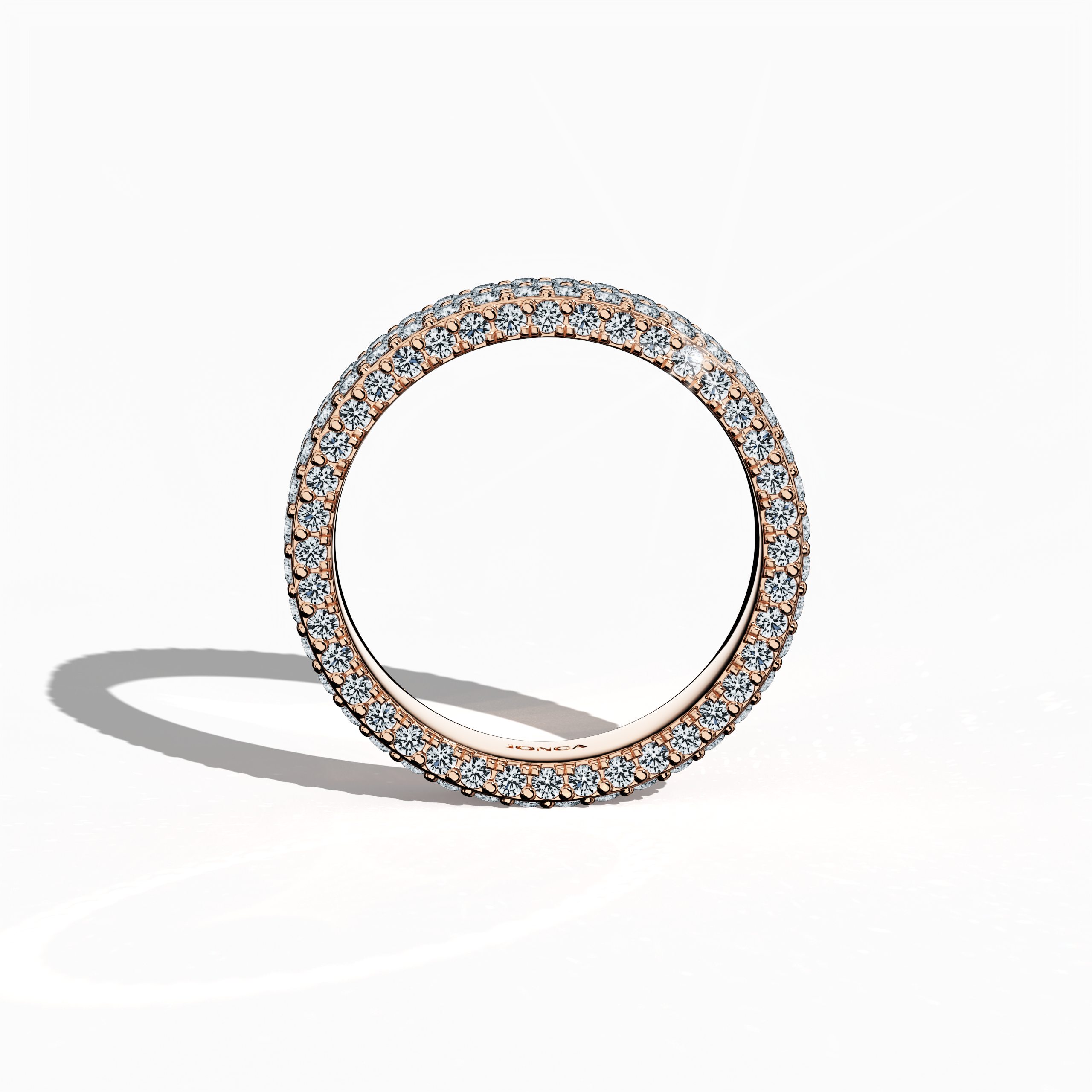 Embrace the sophisticated charm of our rose gold 5‑row diamond band presented in a standing front view. Featuring up to 2.55 carats of micro diamonds expertly set in an intricate pattern, the design exudes a soft, romantic glow. Drawing inspiration from revered 4‑row styles such as Classic, Vintage, Contemporary, Modern, Minimalist, Ornate, Channel‑Set, its warm rose‑tinted finish and delicate craftsmanship symbolize luxurious, international artistry. Keywords: rose gold, micro diamond, luxury, elegant.