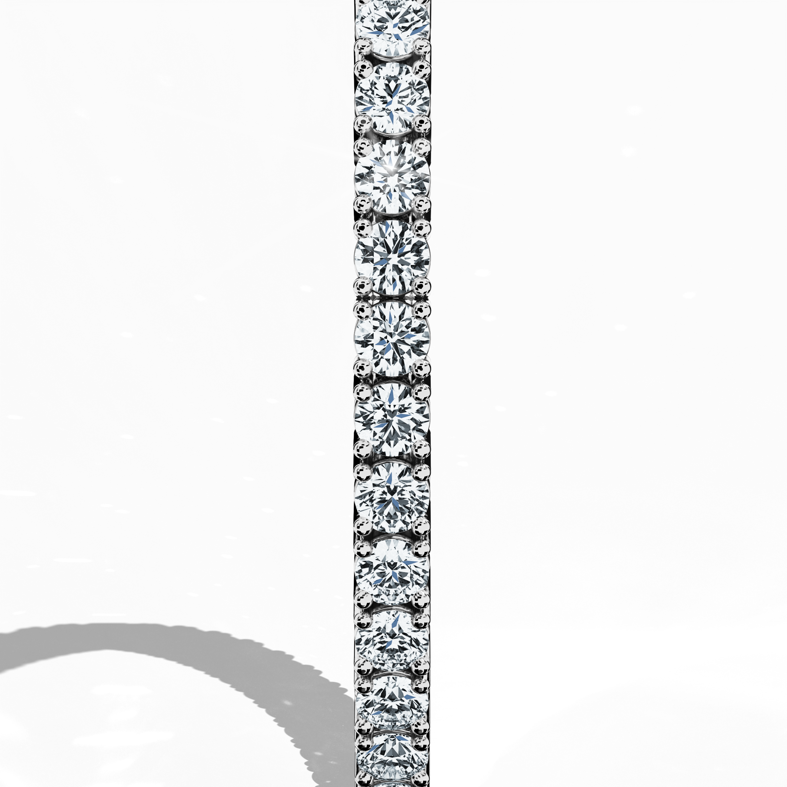 Displayed from a standing side view, this 8-carat diamond tennis bracelet in белое золото (alternatively known as grey gold or palladium gold) reveals a continuous row of prong-set round diamonds. Also called a line bracelet, eternity bracelet, river bracelet, or inline bracelet, its sleek design exudes enduring sophistication and subtle sparkle, perfect for both upscale gatherings and refined daily wear. Keywords: diamond tennis bracelet, белое золото, refined Украшения.