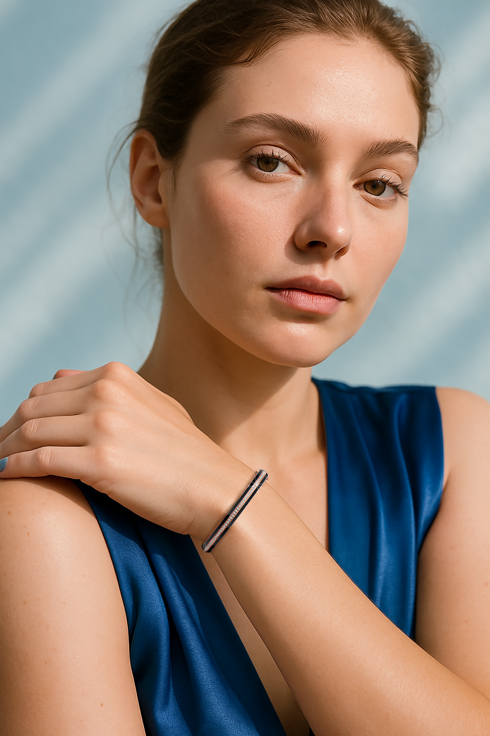 Side enamel center paved bangle in розовое золото (sometimes called blush gold) with black enamel, elegantly displayed on a feminine wrist. Featuring 2.60 carats of diamonds in a pavé setting, this bracelet, armlet, kangan, or pulsera embodies chic allure. Its delicate pinkish metal contrasts with the dark enamel, highlighting the brilliance of the diamonds for a refined statement. Keywords: bangle, enamel, diamonds, розовое золото.