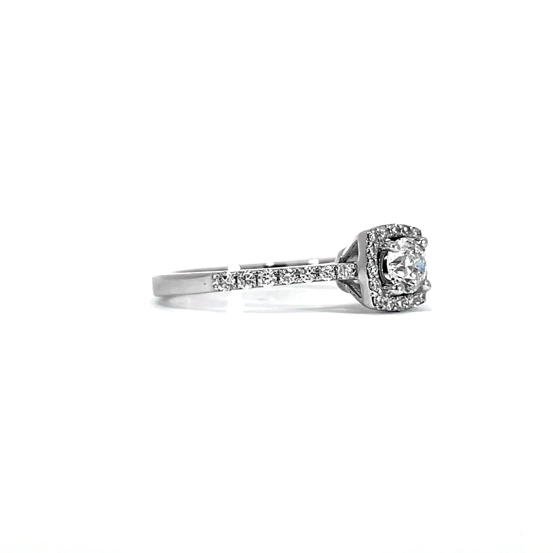 Curved Halo Paved Ring showing 0.50 carat D-F color VVS-VS clarity diamonds in curved halo pave setting 18K white gold
