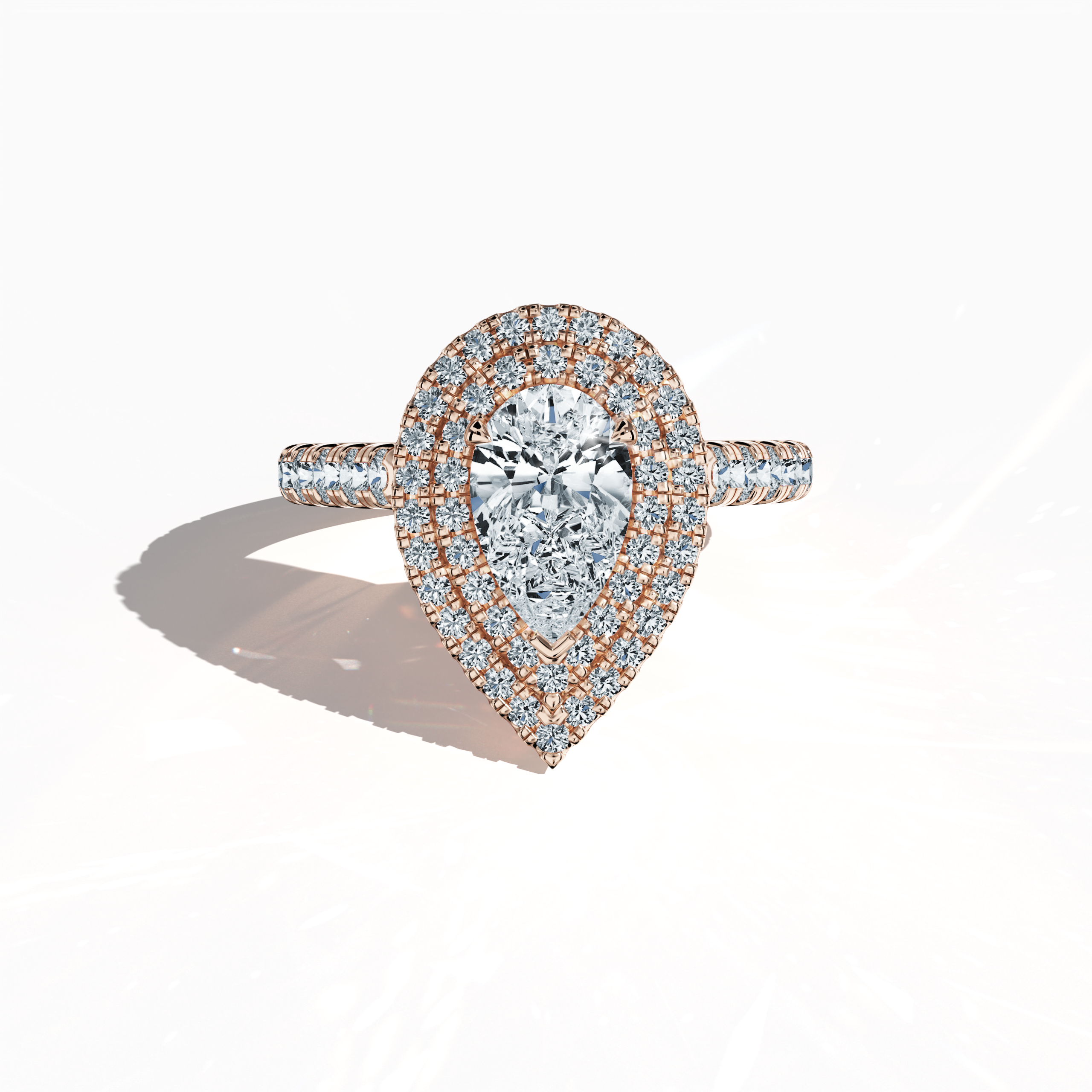 7. Ring Sleeping Front View (Rose Gold):
Image of an exquisite double halo diamond ring in radiant rose gold (also known as blush gold or romantic rose) showcased in a sleeping front view on a clean backdrop. The ring features a brilliant 1ct pear‐cut center diamond—alternatively called teardrop or waterdrop—encircled by up to 1ct of meticulously paved side diamonds. Its design spans double halo, pavé halo, twin halo, cathedral halo, vintage halo, and contemporary halo styles, exuding refined luxury, artist