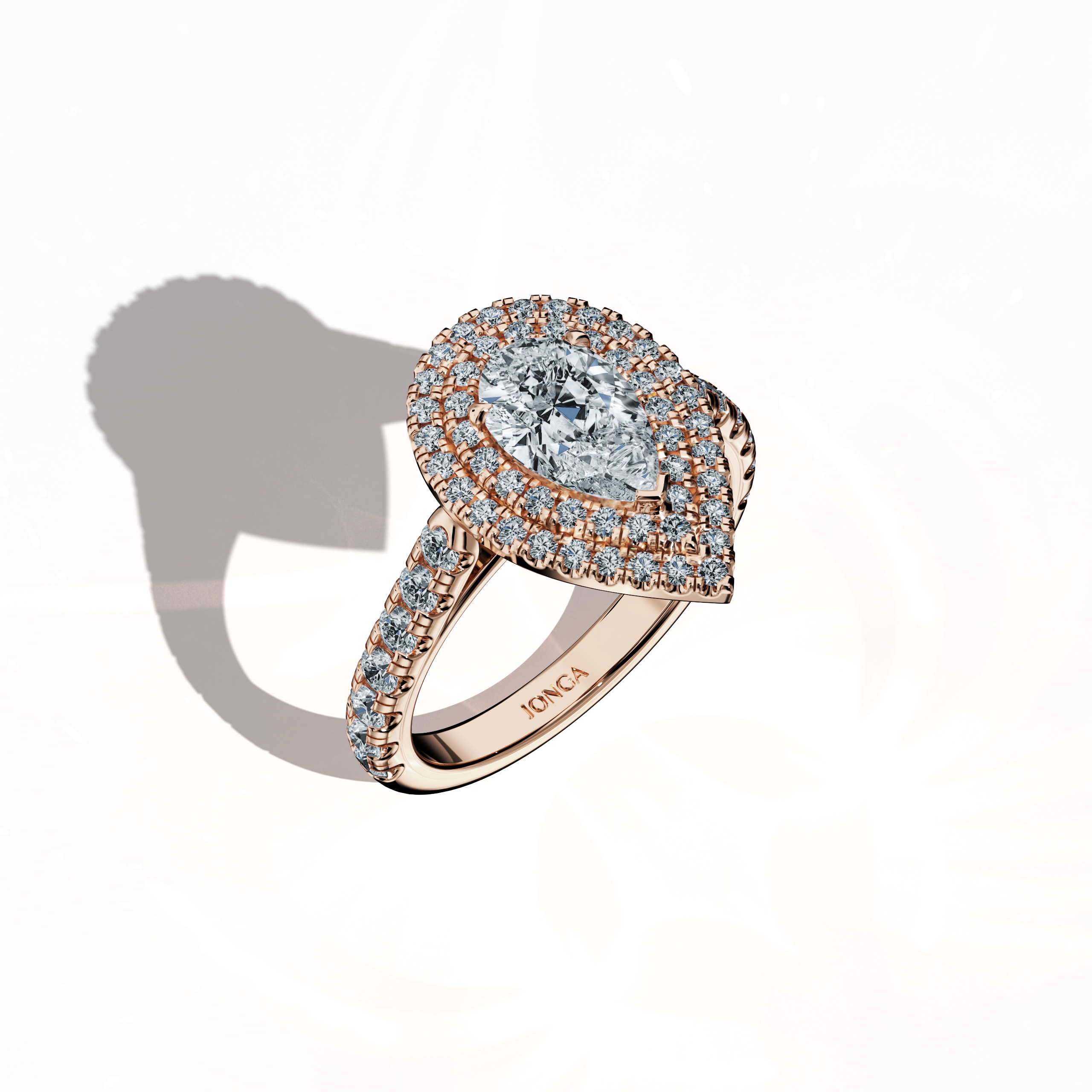 Striking depiction of a double halo diamond ring in alluring rose gold (blush gold/romantic rose) captured in a standing front top side view. The ring features a stunning 1ct pear‐cut center diamond (teardrop, waterdrop) encircled by up to 1ct of pave-set side diamonds. Incorporating design motifs such as double halo, pavé halo, twin halo, cathedral halo, vintage halo, and contemporary halo, it radiates luxurious elegance, meticulous detailing, and a fusion of classic and modern international aesthetics.