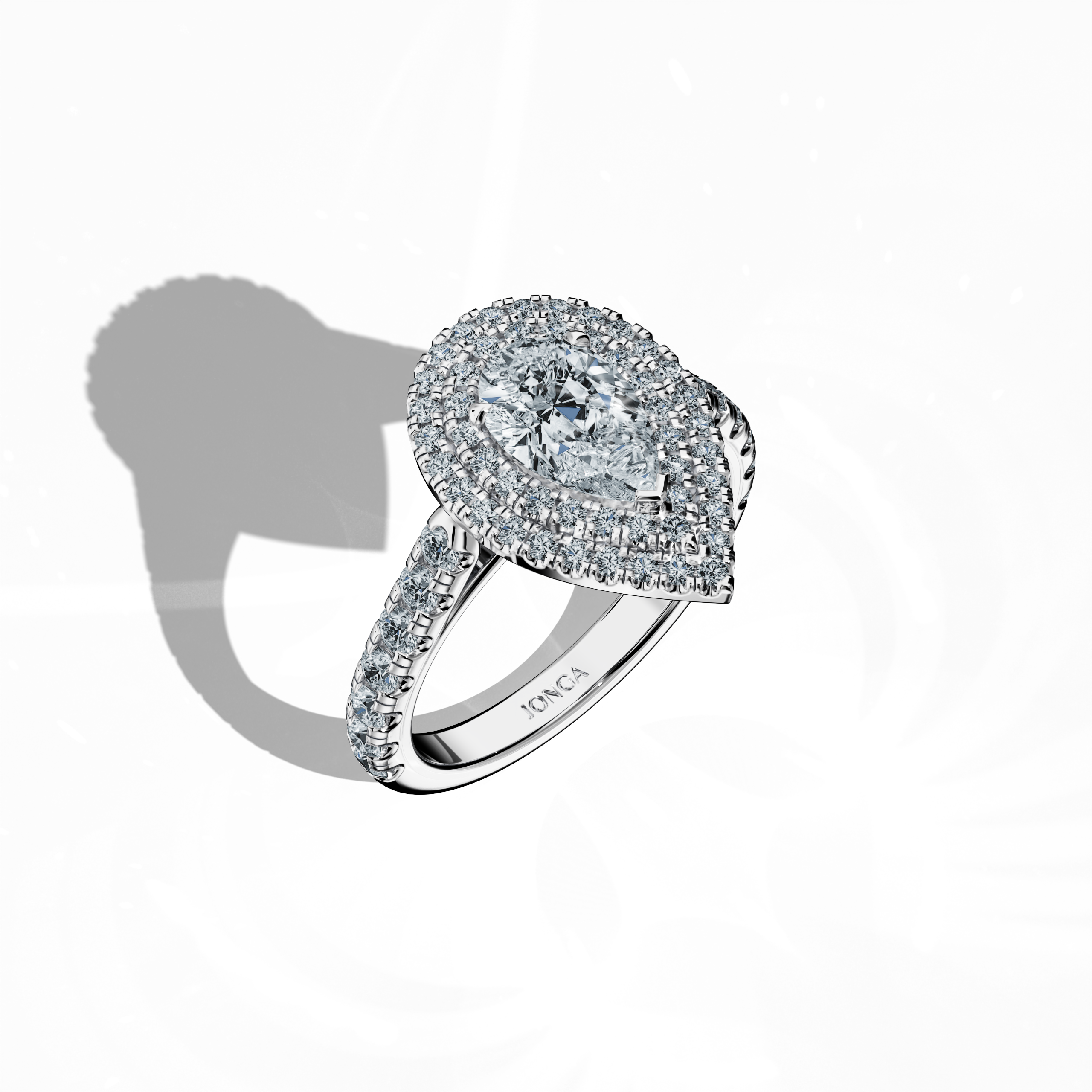 Striking depiction of a double halo diamond ring in radiant белое золото (also known as sterling or luminous white) captured in a standing front top side view. Showcasing a 1ct pear‐cut center diamond (teardrop, waterdrop) embraced by up to 1ct of pave-set side diamonds, its design incorporates double halo, pavé halo, twin halo, cathedral halo, vintage halo, and contemporary halo styles. This perspective exudes intricate detailing, refined luxury, and a blend of classic and modern international aesthetics.