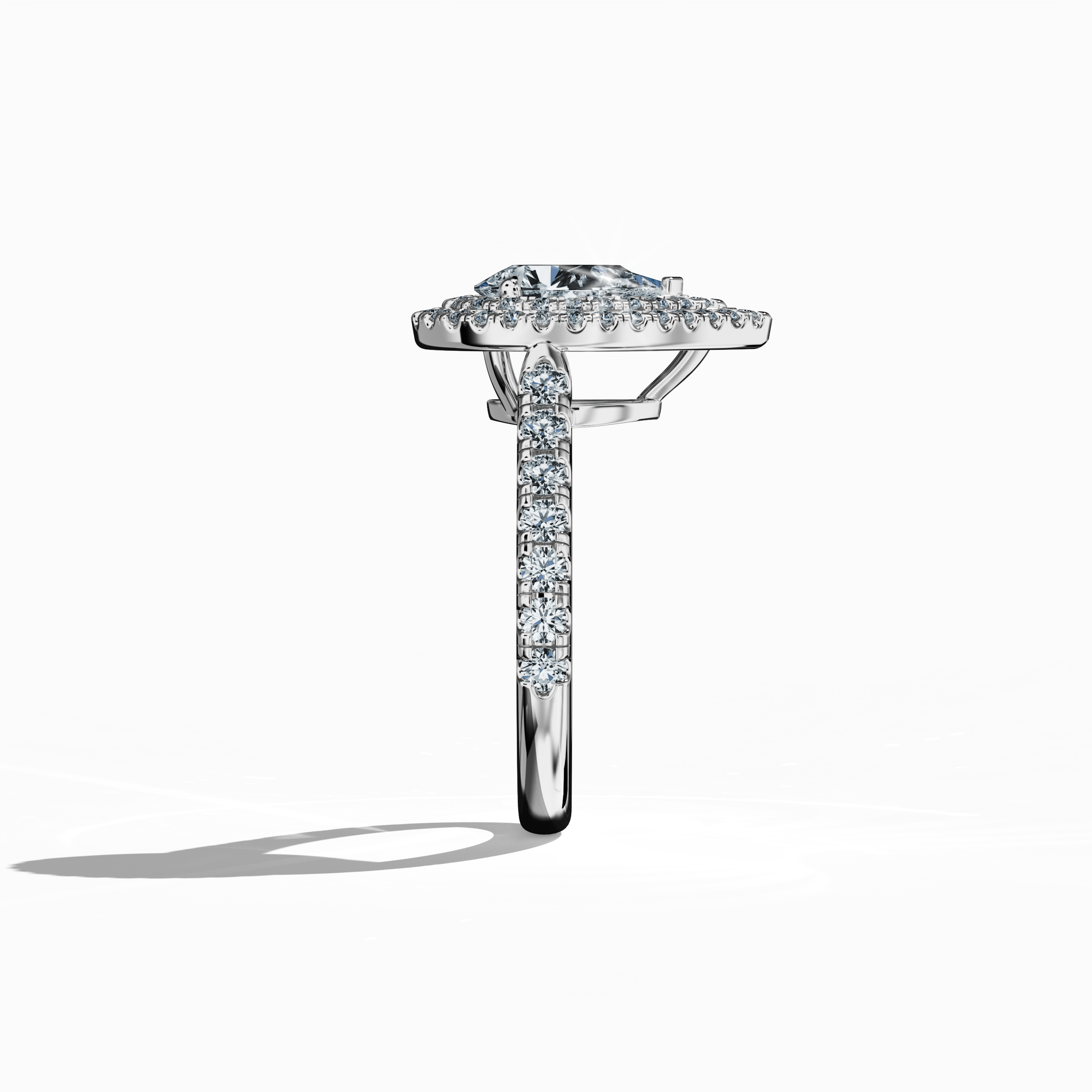 Detailed image capturing the side profile of a refined double halo diamond ring in brilliant белое золото (sterling white/luminous white). The ring’s silhouette reveals a 1ct pear‐cut center diamond—alternatively termed teardrop or waterdrop—flanked by a meticulously paved halo of up to 1ct side diamonds. Embracing design variations such as double halo, pavé halo, twin halo, cathedral halo, vintage halo, and contemporary halo, this view highlights sleek contours, luxury, and international design finesse.