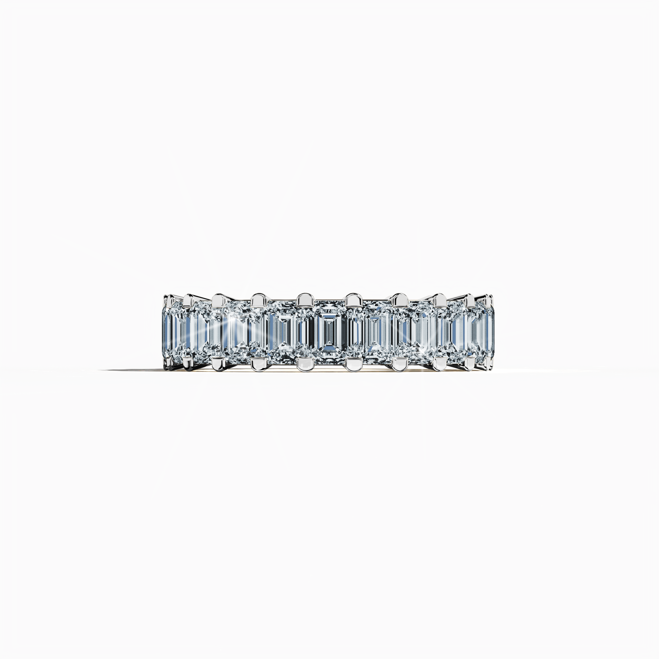 Captured in a delicate sleeping front view, this stunning Emerald Eternity ring showcases a luminous white gold band, revered as argent or platinum-toned gold in diverse design lexicons. Embracing celebrated design identities such as Eternal Emerald, Infinity Emerald, and Everlasting Allure, the ring features up to 24 meticulously set, sparkling diamonds totaling 4.55 carats, perfectly encircling a vibrant emerald centerpiece. Keywords: luxury, fine jewelry, timeless elegance, innovative design, exquisite.