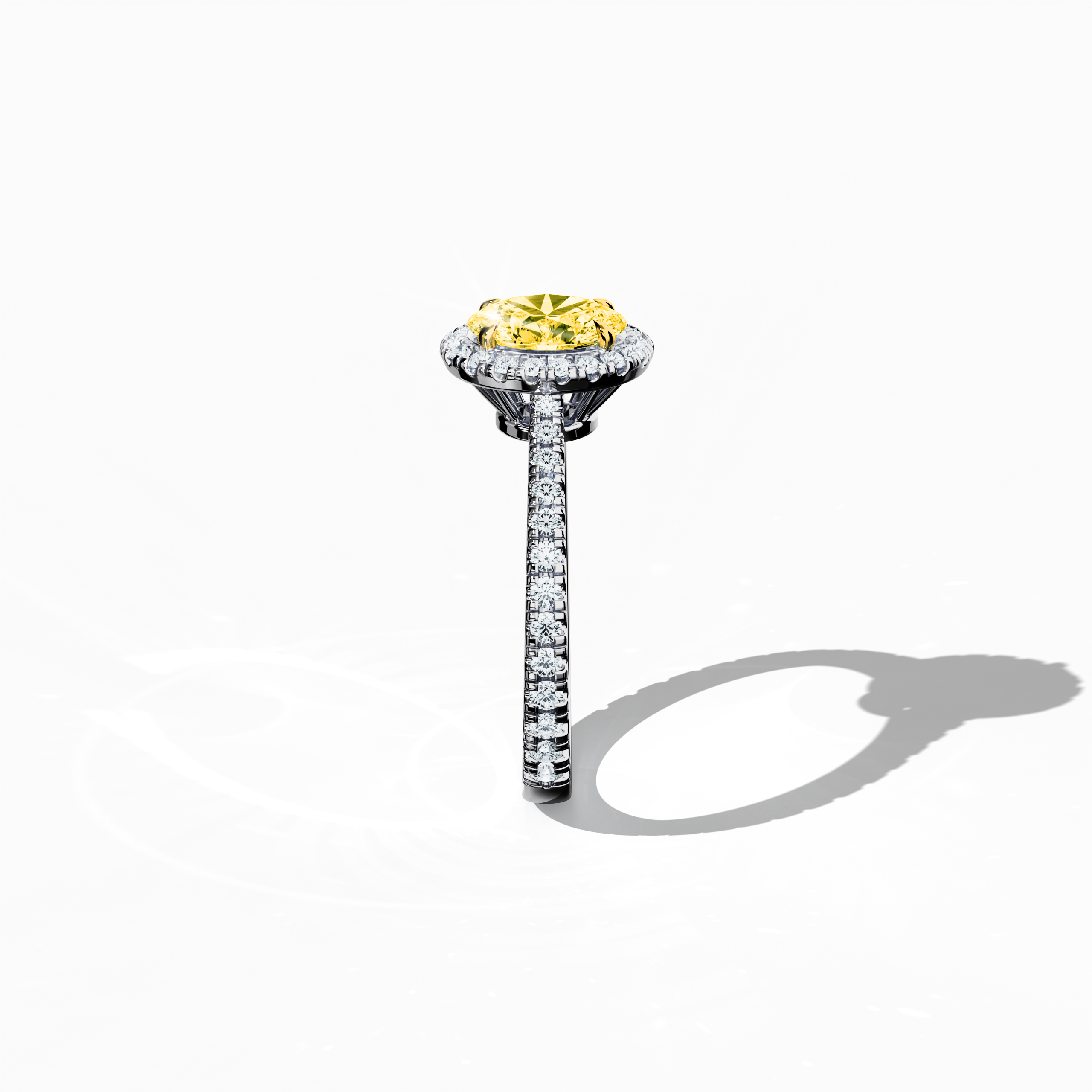 Revealed in a detailed standing side view, this halo paved ring in immaculate white gold showcases a brilliant 1 carat yellow oval‐cut diamond center framed by a 0.60 carat halo of luminous side stones, amounting to 1.60 carats of exquisite brilliance. Featuring Classic Halo, Modern Halo, Vintage Halo, Contemporary Halo, and Eternity Halo inspirations with oval and brilliant cut accents, its frosted, platinum‐like finish exudes refined luxury and sophisticated charm. Keywords: handcrafted, sparkle, elegance