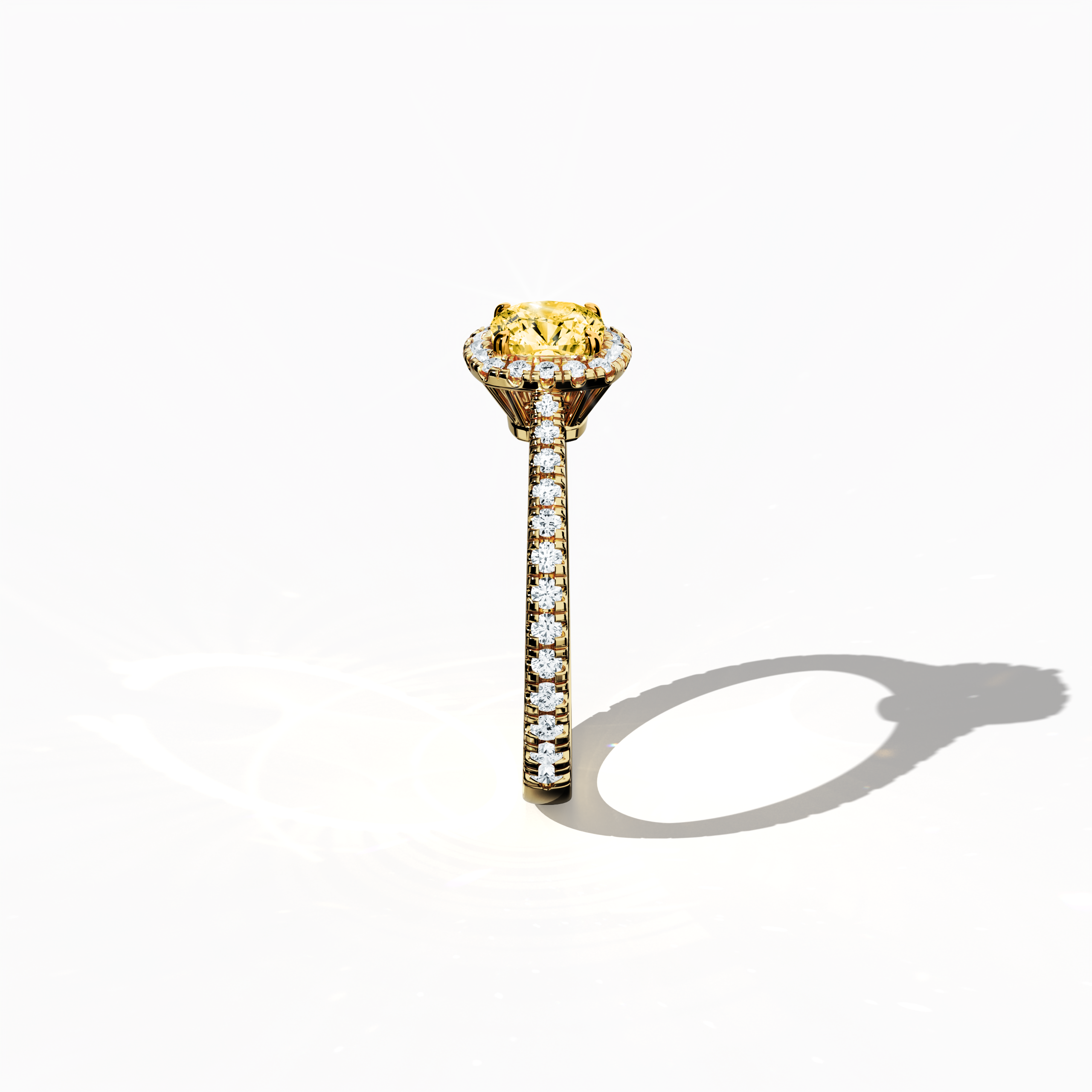 Captured in a detailed standing side view, this halo paved ring in sumptuous yellow gold reveals a brilliant 1ct yellow cushion‐cut diamond centerpiece encircled by a 0.60ct halo of luminous side stones, amounting to 1.60 carats overall. Merging Classic Halo, Modern Halo, Vintage Halo, Contemporary Halo, and Eternity Halo design elements with inspirations from cushion, radiant, and princess cuts, it also includes alternative gold descriptors such as amber and sunny. Keywords: luxury, handcrafted, elegance.