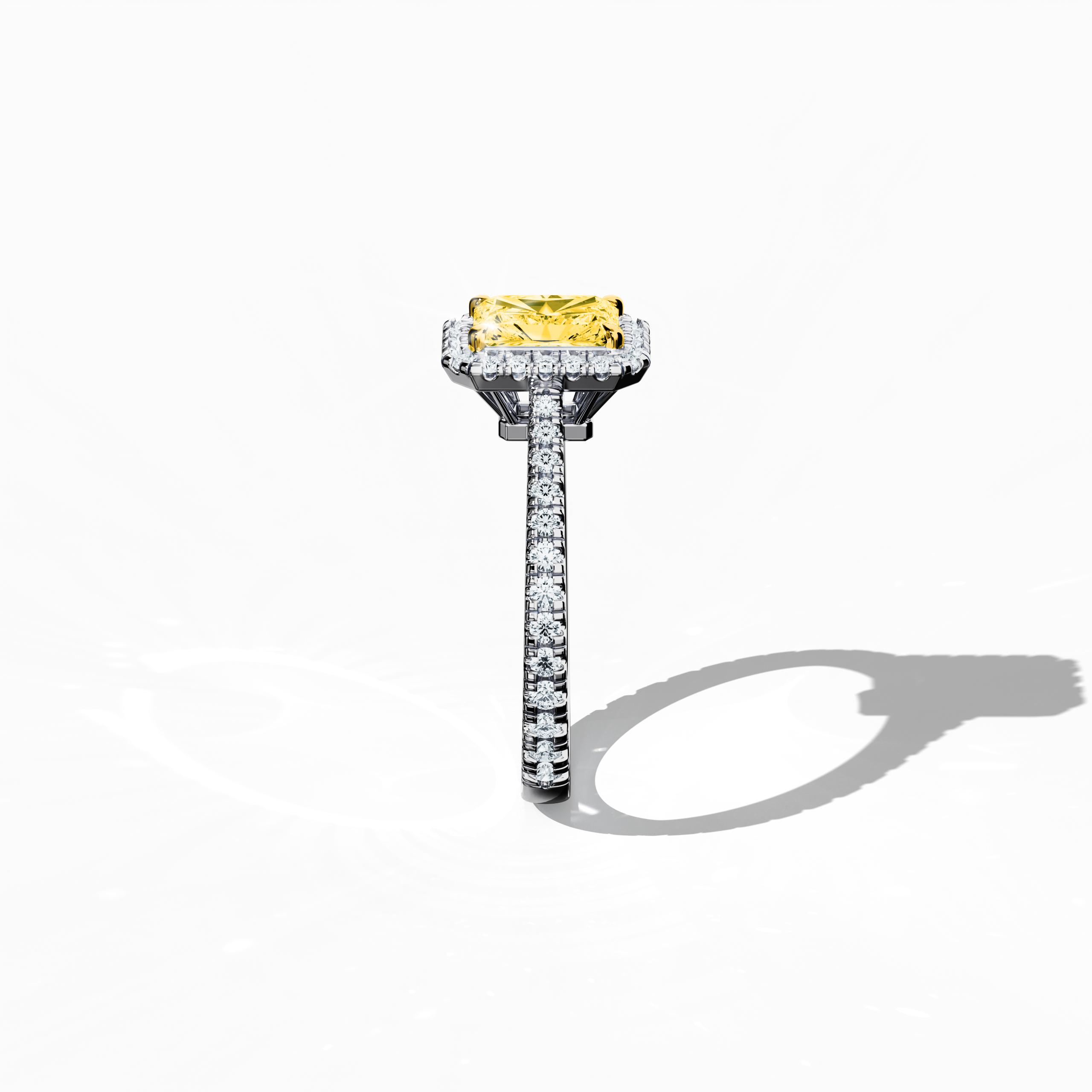 Revealed in a detailed standing side view, this halo paved ring in elegant белое золото highlights a stunning 1 carat yellow radiant‐cut diamond center set within a 0.60 carat halo of sparkling side stones, summing to 1.60 carats. Combining Classic Halo, Modern Halo, Vintage Halo, Contemporary Halo, and Eternity Halo design elements with inspirations from radiant, brilliant, and oval cuts, the ring exhibits an icy, silvery, платина‐like finish. Keywords: luxury, crafted, sparkle, refined, exquisite.