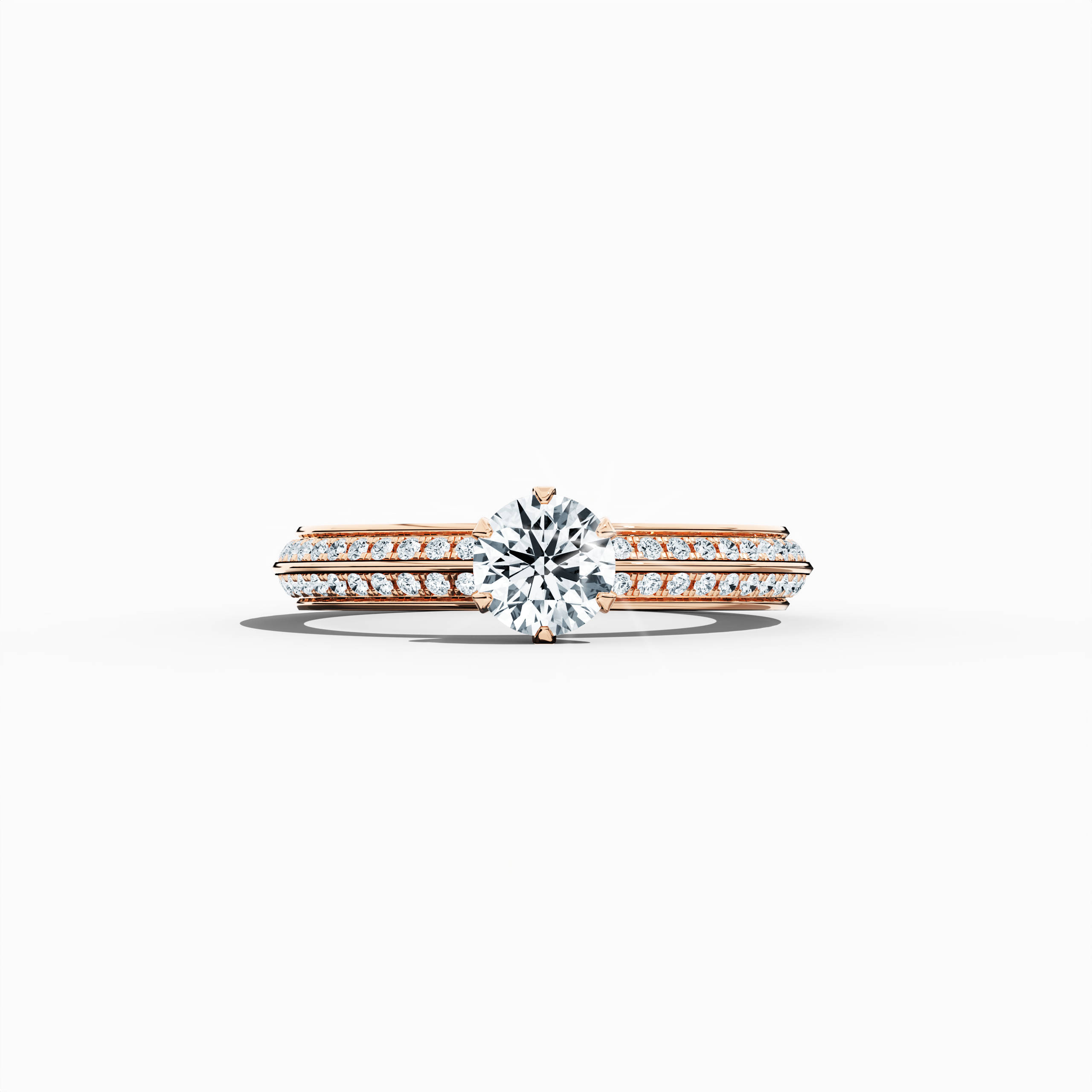 Solitaire paved ring with 0.90 ct total diamonds – featuring a 0.50 ct center diamond and 0.40 ct pavé side stones – set in a soft rose gold band with a modern two‑step band design and a sharp central line. Shown in a sleeping front view on a flat surface, this fine jewelry/fine jewellery ring exudes a warm, romantic glow and refined elegance.