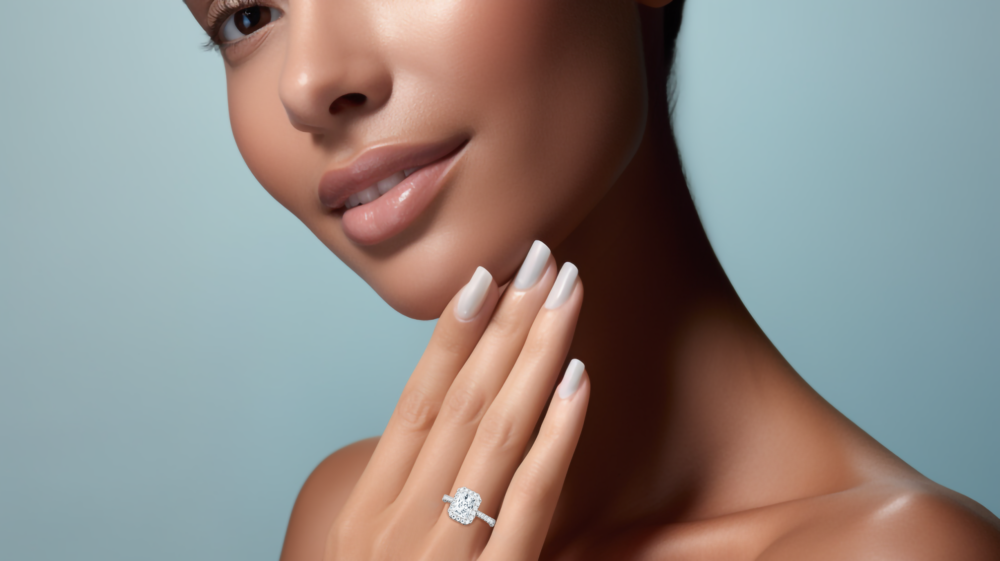 Stunning image of a белое золото halo paved ring elegantly worn on her finger, featuring a sparkling 1 carat radiant-cut center diamond with a surrounding 0.60ct side diamond halo. The finely pavé-set band in white, silver, and pale gold exudes refined luxury and artisanal excellence. Incorporating classic halo, vintage halo, modern halo, and bridal halo motifs, the ring radiates radiant brilliance, timeless charm, and sophisticated elegance. Keywords: chic, graceful, luxury Украшения.