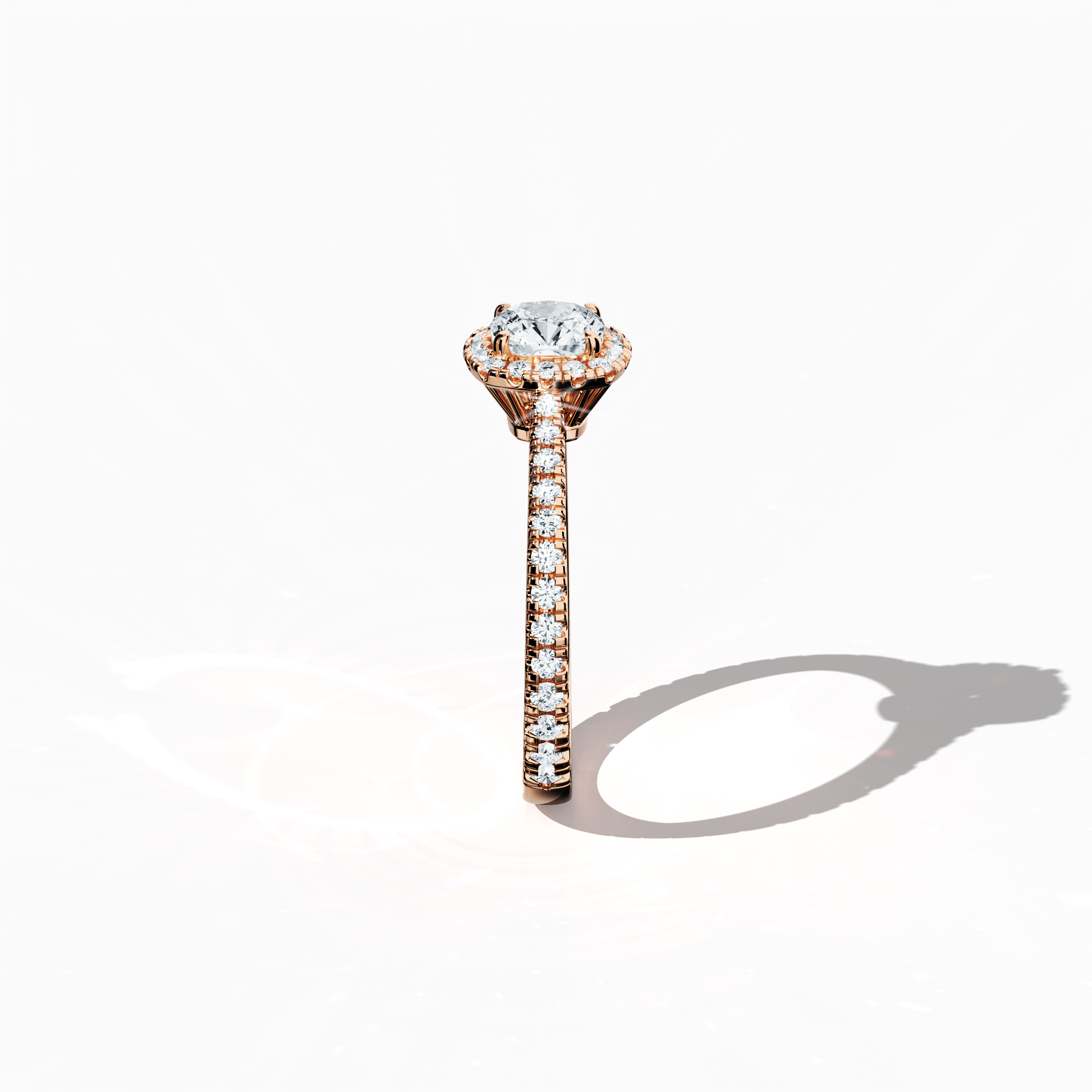 Revealed in a crisp standing side view, the halo paved diamond ring in enchanting розовое золото exudes soft, romantic allure. The 1 карат cushion center diamond, encircled by a 0.60 карат halo of brilliant side stones for a total of 1.60 carats, is rendered in a design that merges Classic Halo, Eternity Halo, and Modern Halo influences with cushion and princess cut accents, all set in a warm, pink, blush finish. Keywords: luxury, sparkle, создано вручную, elegant, radiant.