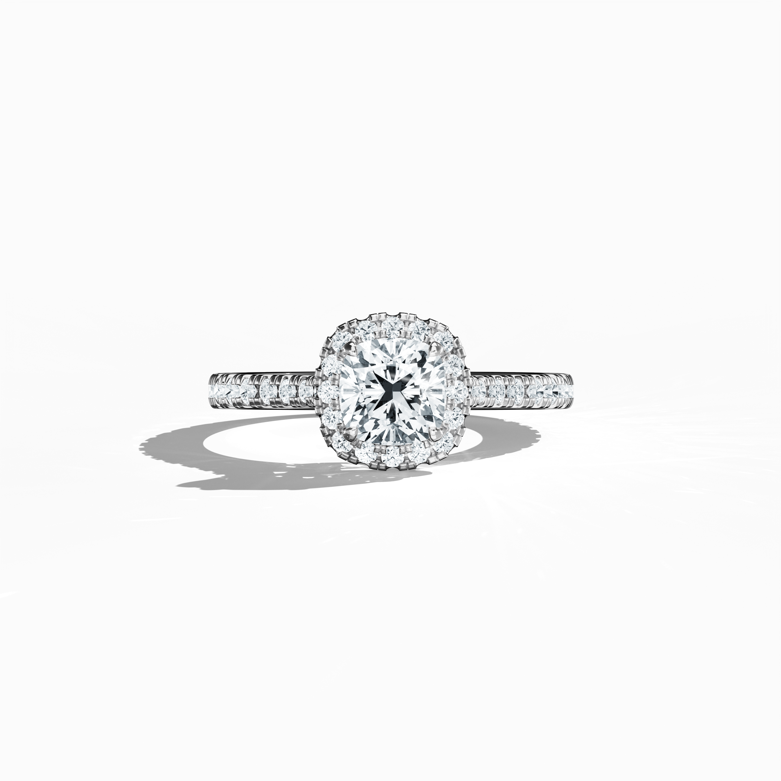 Displayed in a soft sleeping front view, this halo paved diamond ring in exquisite белое золото radiates refined brilliance. With a total weight of 1.60 carats, its 1 карат cushion cut centerpiece is encircled by a 0.60 карат halo of glistening side stones. The design fuses Classic Halo, Modern Halo, and Vintage Halo aesthetics with cushion and radiant influences, highlighted by a frosted, silver-toned finish. Keywords: luxury, создано вручную, sparkle, elegant, diamond.