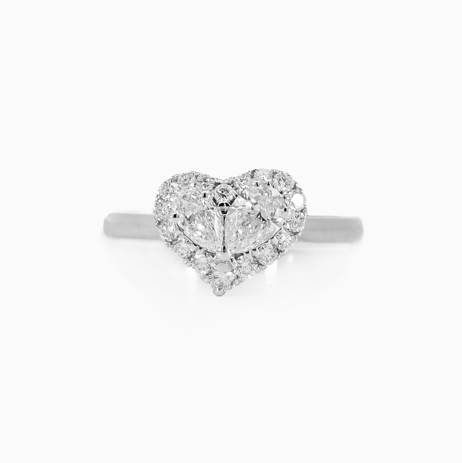Heart shaped pear diamond halo ring 0.70 carat total 0.30 carat center GIA certified F color VS clarity 18K white gold Dubai