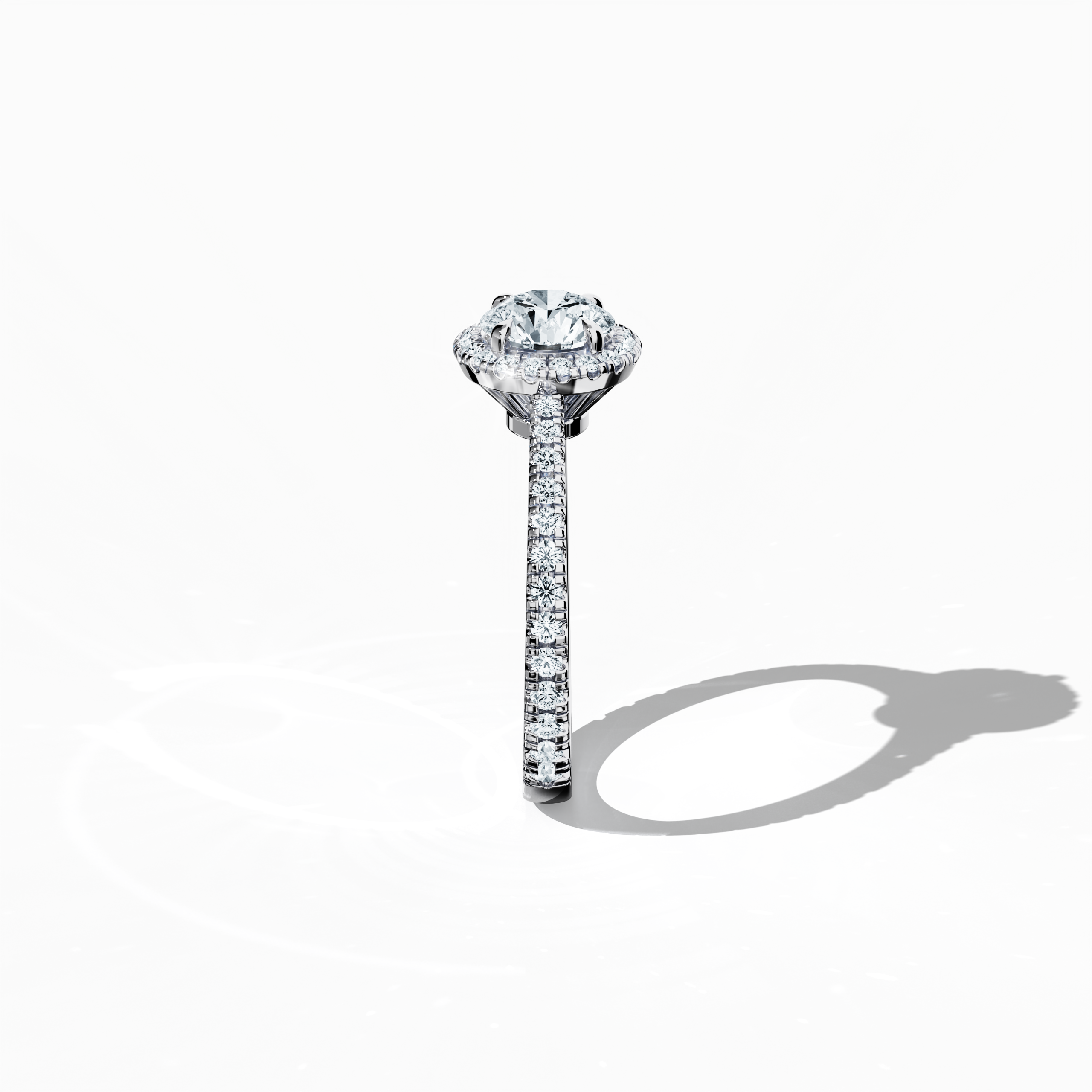 Detailed standing side view of a белое золото halo paved ring accentuating its elegant profile and gracefully curved band featuring a 1ct round‐cut center diamond paired with a 0.60ct side diamond halo. The lateral angle reveals intricate pavé details in white, silver, and pale gold tones, blending influences of classic halo, vintage halo, modern halo, and bridal halo designs. Keywords: refined, round brilliance, artisanal, luxury, international style.