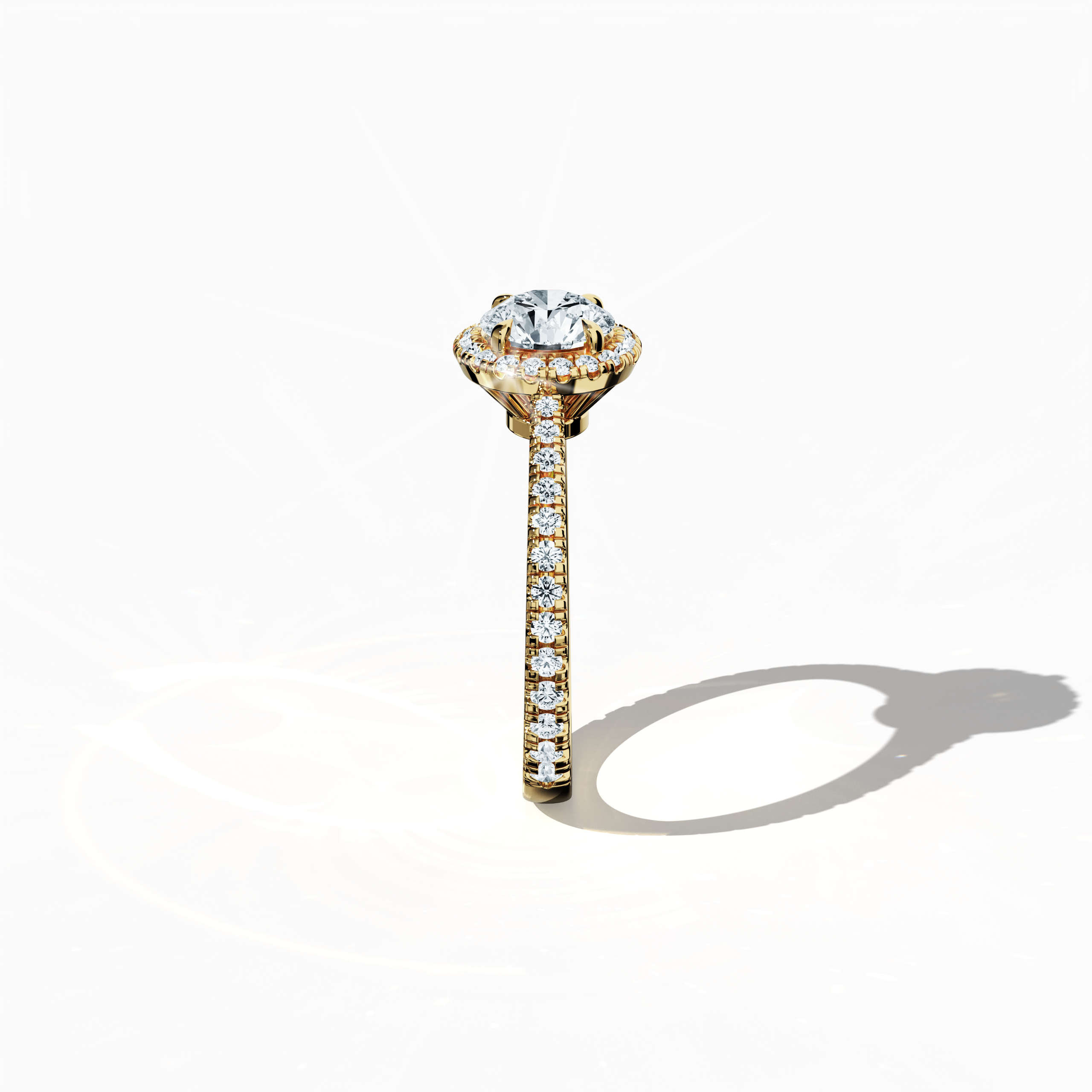 Detailed standing side view of a жёлтое золото halo paved ring accentuating its elegant profile and gracefully curved band featuring a 1ct round‐cut center diamond paired with a 0.60ct side diamond halo. The lateral angle reveals intricate pavé details in rich yellow, sun, and traditional gold tones, blending influences of classic halo, vintage halo, modern halo, and bridal halo designs. Keywords: refined, round brilliance, artisanal, luxury, contemporary style.