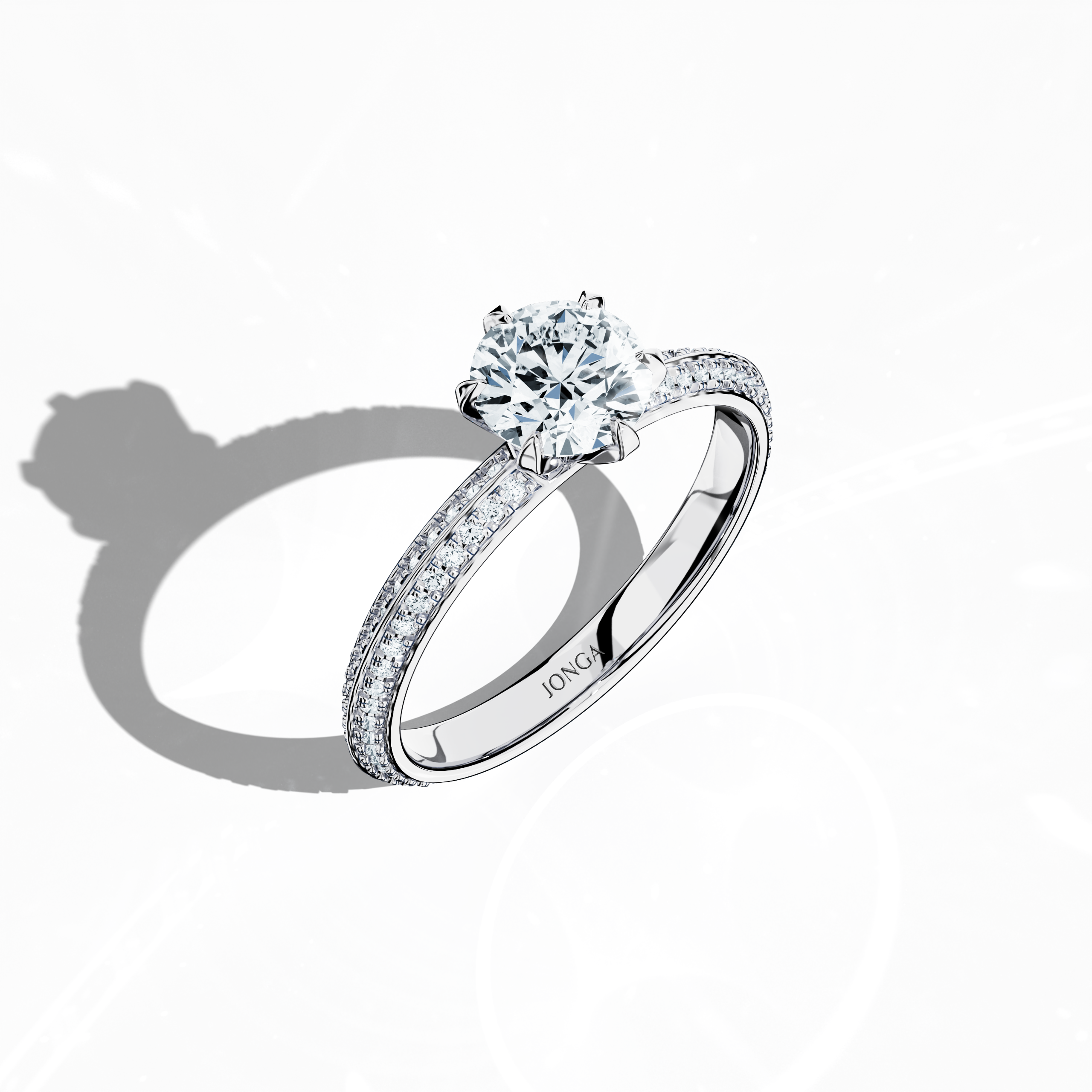 Modern 1.40 карат paved diamond ring featuring a 1 карат center diamond and 0.40 карат pavé side stones, set in bright белое золото with a dual‑tier, step-designed band and a defined central line. Captured from a front top side angle, this fine Украшения/fine Ювелирные изделия ring emphasizes its refined pavé setting and luminous finish.
