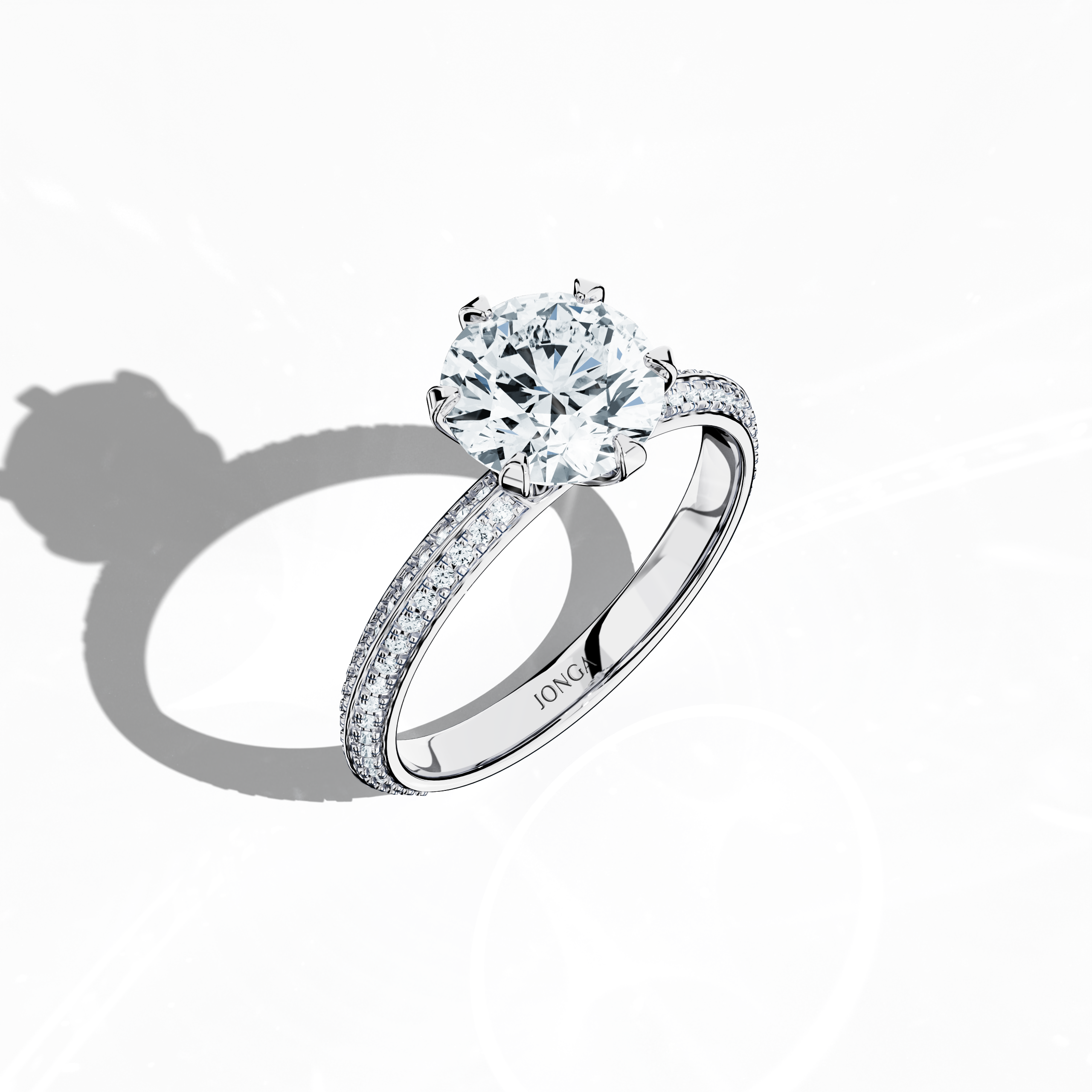Modern 2.40 карат solitaire paved ring featuring a 2 карат center diamond and 0.40 карат pavé side stones, set in a silvery белое золото band with a dual‑tier, step‑designed band and a striking central line. Captured from a front top side angle, this fine Украшения/fine Ювелирные изделия ring emphasizes its sophisticated pavé setting and luminous finish.