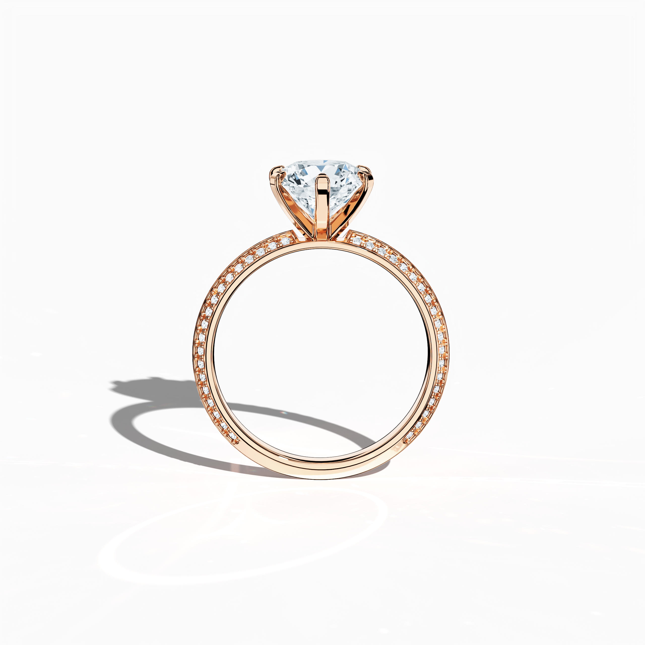 Classic solitaire diamond ring with 2.40 ct total carats—2 ct center diamond and 0.40 ct pavé side stones—set in soft rose gold (blush/pink gold) with a distinctive two‑step band featuring a crisp central line. Displayed in a front view, this fine jewelry/fine jewellery ring offers a perfect blend of brilliant sparkle and contemporary romance.