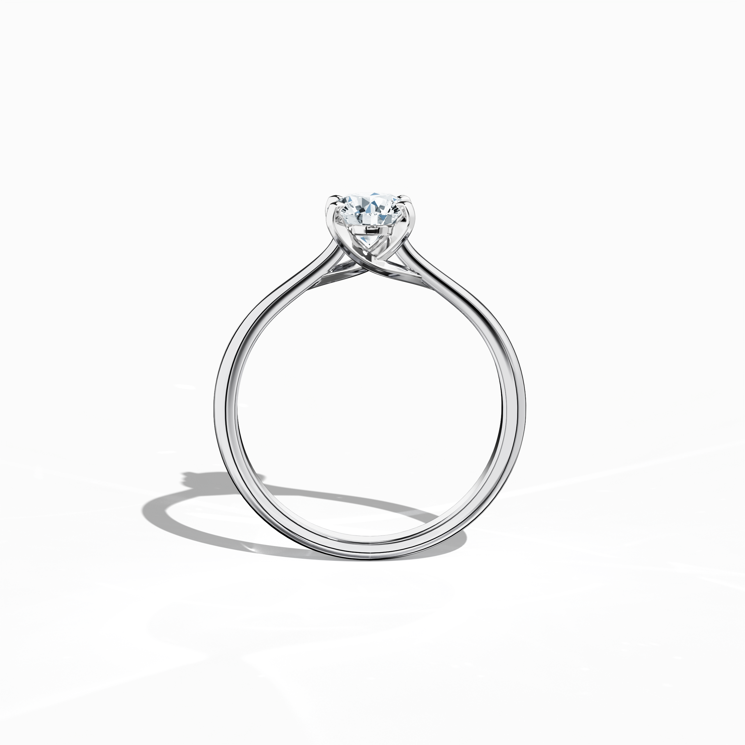 Refined solitaire diamond ring with a 0.70  карат center stone in a unique twisted bottom setting and four‑tap prongs in белое золото, set with a bright белое золото band. Shown from a standing front view, this fine Украшения/fine Ювелирные изделия ring exhibits a balanced silhouette and a striking, luminous profile.