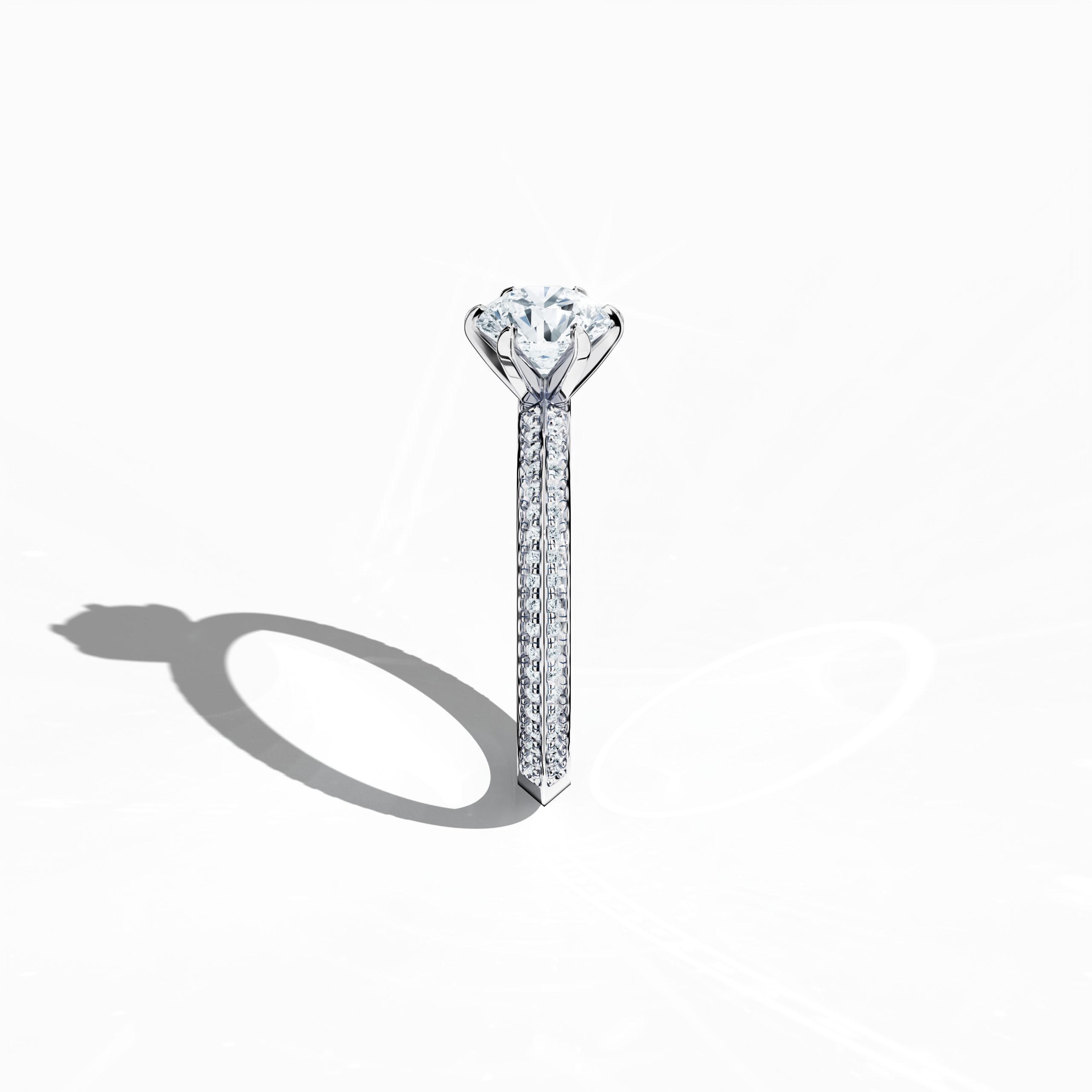 Refined solitaire paved ring with 1.40 карат diamonds – 1 карат center and 0.40 карат pavé side stones – set in bright белое золото with a two‑step band featuring a defined central line. Photographed from a standing side view, this fine Украшения/fine Ювелирные изделия ring showcases its sleek contours and exceptional diamond brilliance.