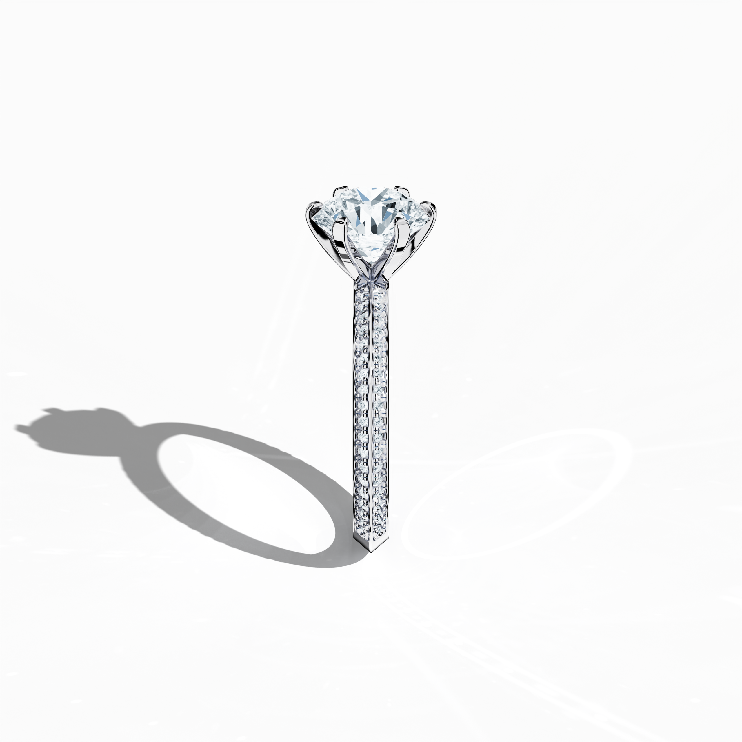 Refined solitaire paved ring with 2.40 карат total diamonds (2 карат center, 0.40 карат side stones) in a six‑prong setting and a two‑step band with a defined central line, set in bright белое золото. Photographed from a standing side view, this fine Украшения/fine Ювелирные изделия ring showcases its sleek contours and brilliant, silvery finish.