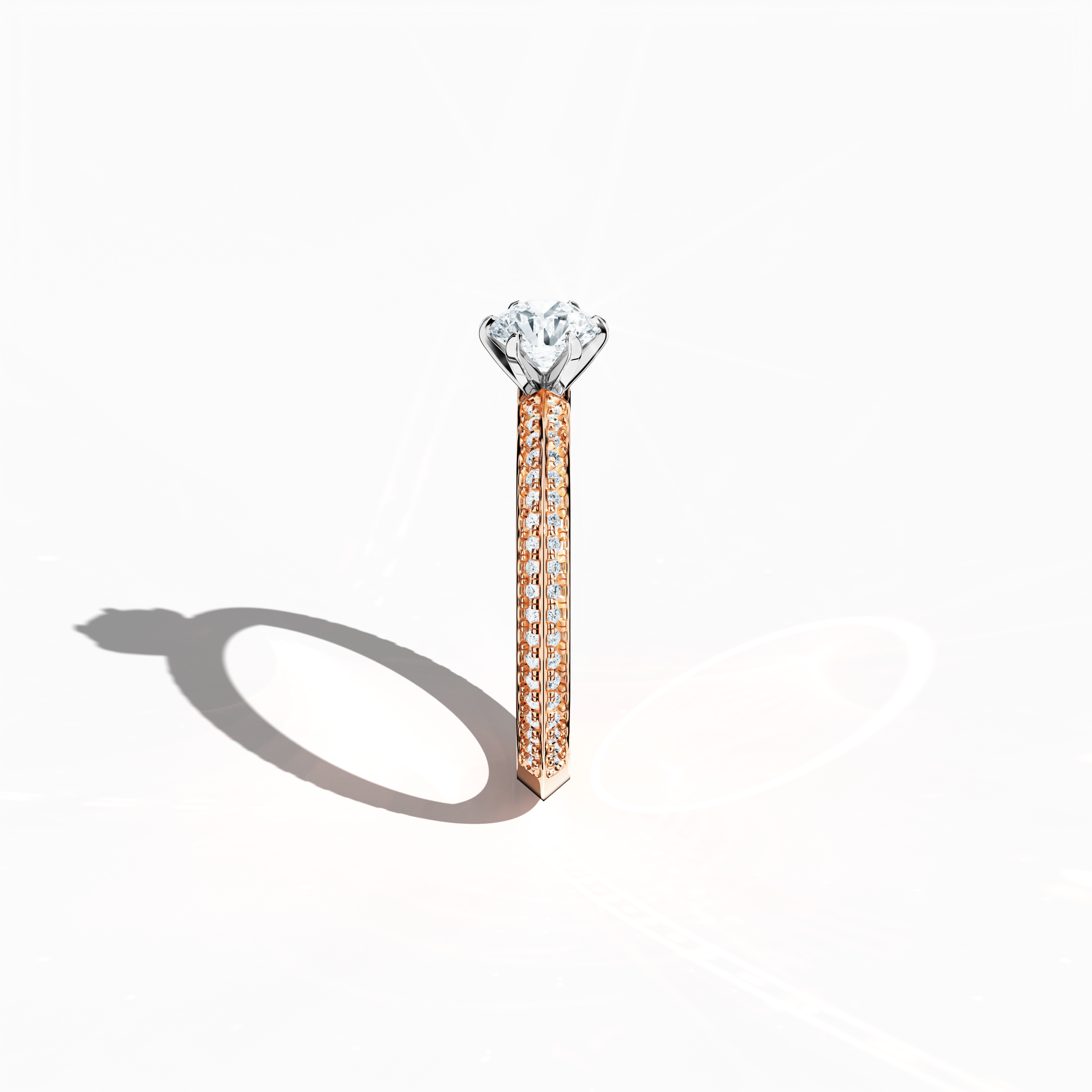 Refined solitaire paved ring with 0.90 карат of diamonds, featuring a 0.50 карат center stone and 0.40 карат pavé side stones, set in soft розовое золото (blush/pink gold) with a two‑step band design marked by a sharp central line. Photographed from a standing side view, this fine Украшения/fine Ювелирные изделия ring showcases its elegant contours and warm, romantic allure.