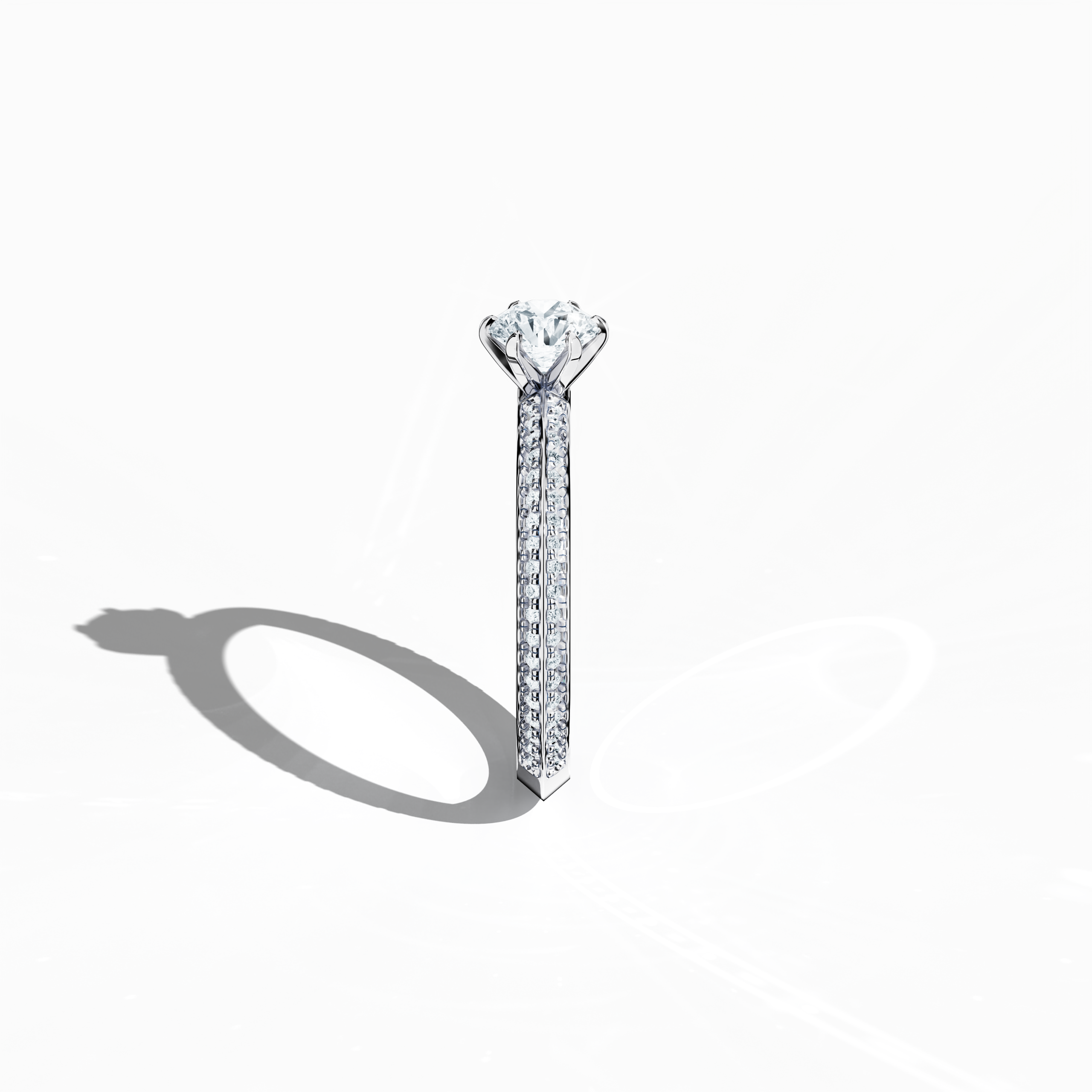 Refined solitaire paved ring with 0.90 карат of diamonds – a 0.50 карат center diamond and 0.40 карат pavé side stones – set in bright белое золото with a two‑step band featuring a defined central line. Photographed from a standing side view, this fine Украшения/fine Ювелирные изделия ring showcases its clean contours and exceptional diamond brilliance.
