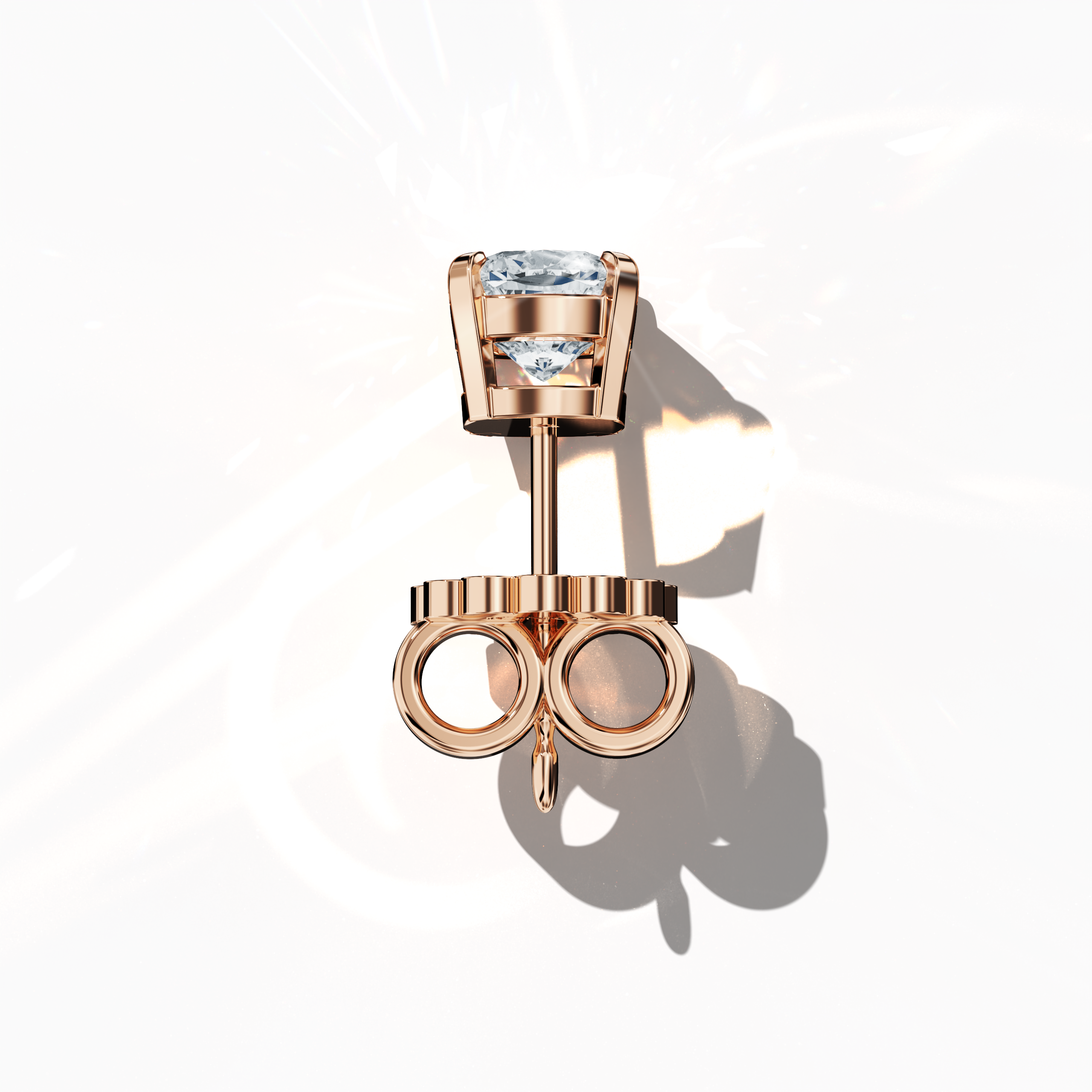Top view of 1-carat natural diamond earring in 18k розовое золото with nail prong setting; features a cushion cut diamond (also known as cushion brilliant or pillow cut diamond in various regions) – luxury fine Украшения/fine Ювелирные изделия ear accessory.