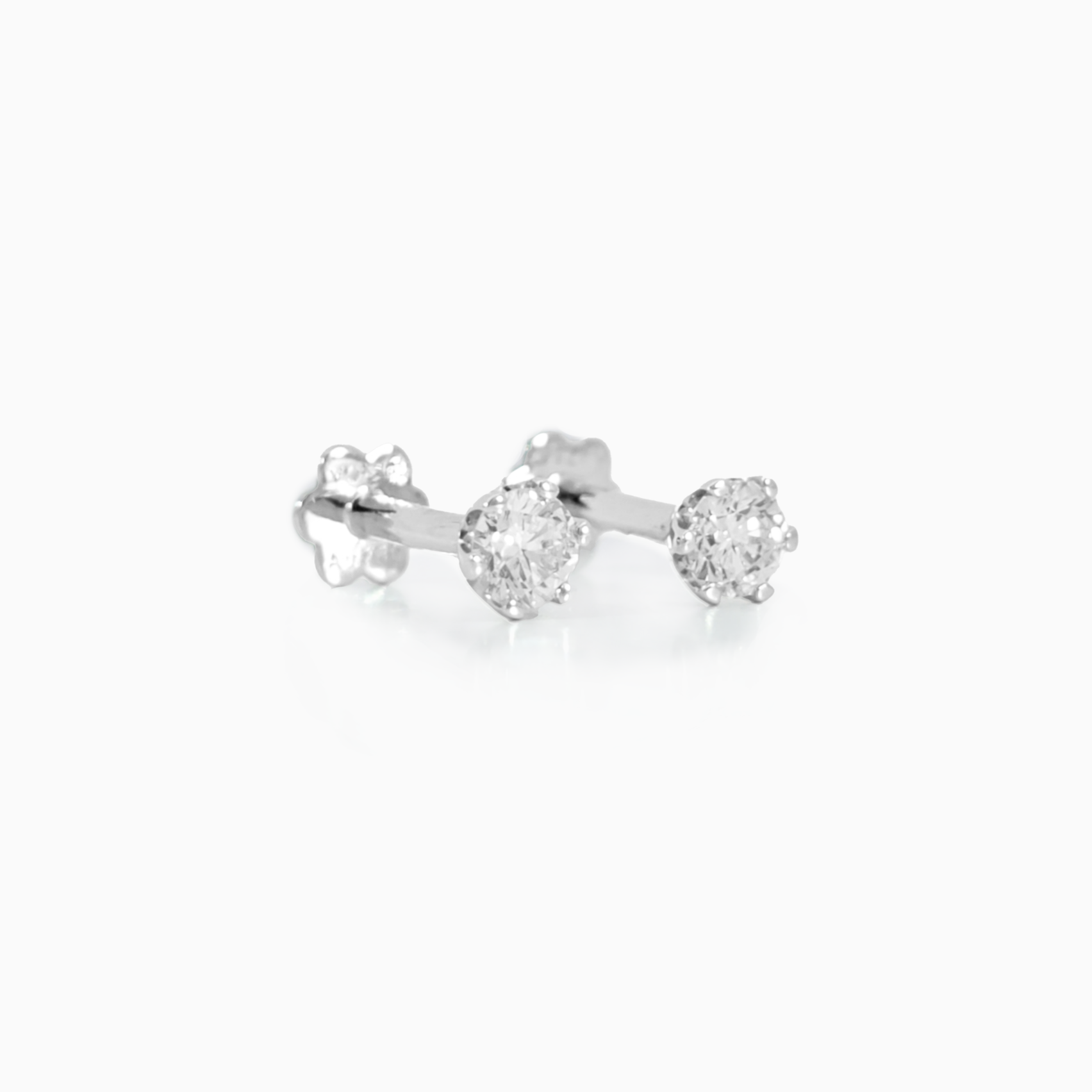 Classic Studs earrings side view showing 0.12 carat D-F color VS clarity diamonds in polished 18K white gold