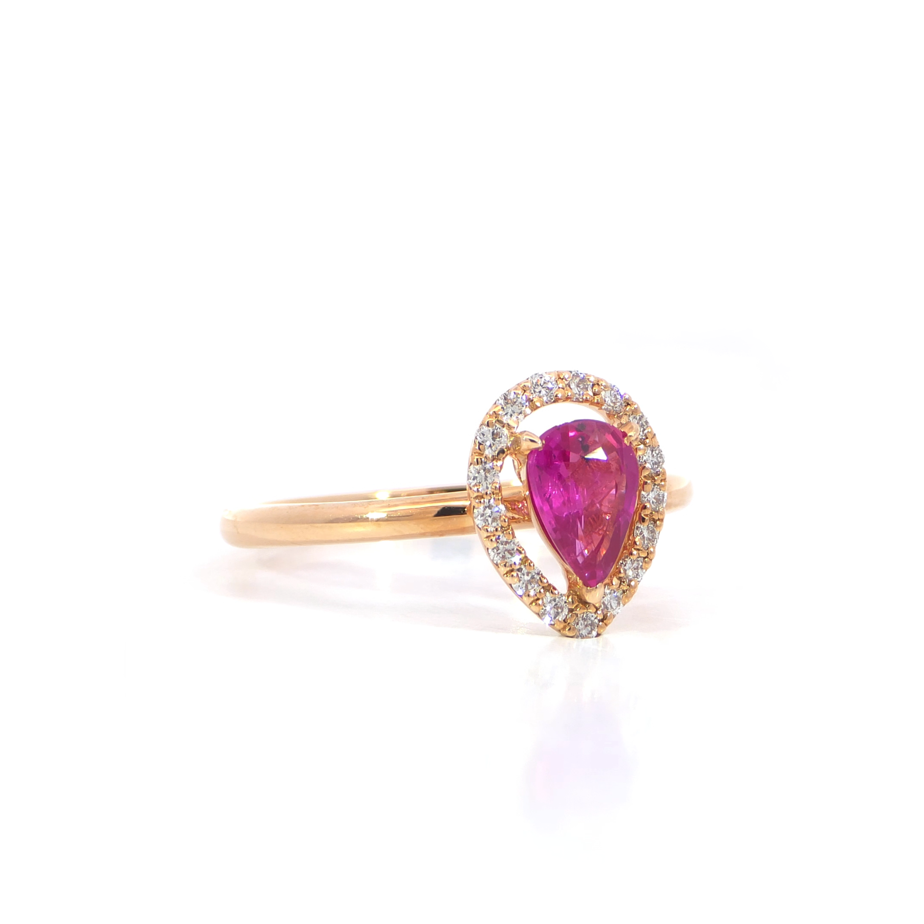 Pear pink ruby halo ring side view showing 0.65 carat pear cut pink sapphire with diamond halo 18K white gold
