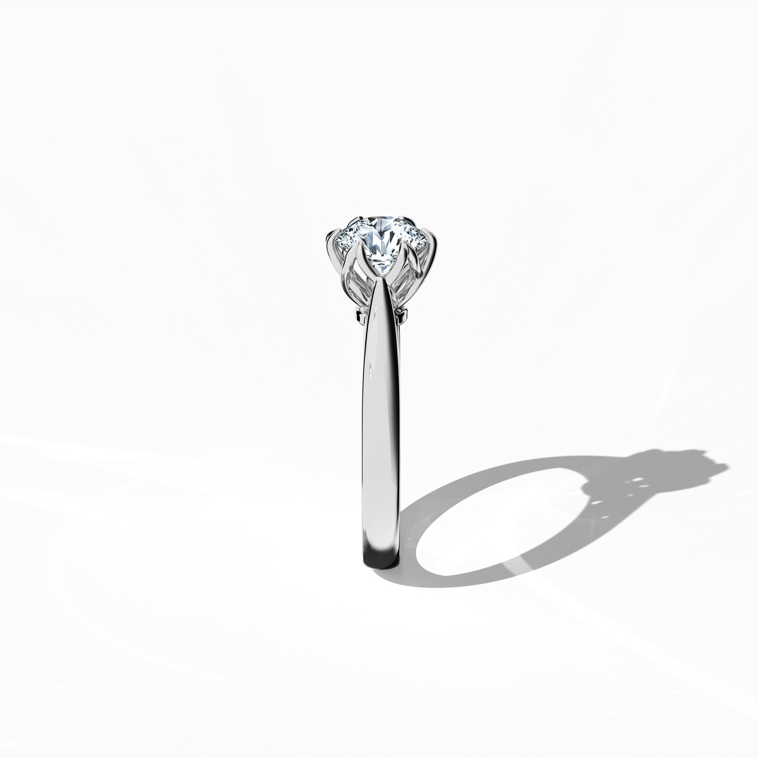Modern 1‑carat lotus solitaire ring with a 1‑carat center diamond in an artistic lotus‑inspired design, with six prongs and a twisted band, all rendered in bright белое золото. Photographed from a standing side view, this fine Украшения/fine Ювелирные изделия ring reveals its elegant contours and sleek, minimalist profile.