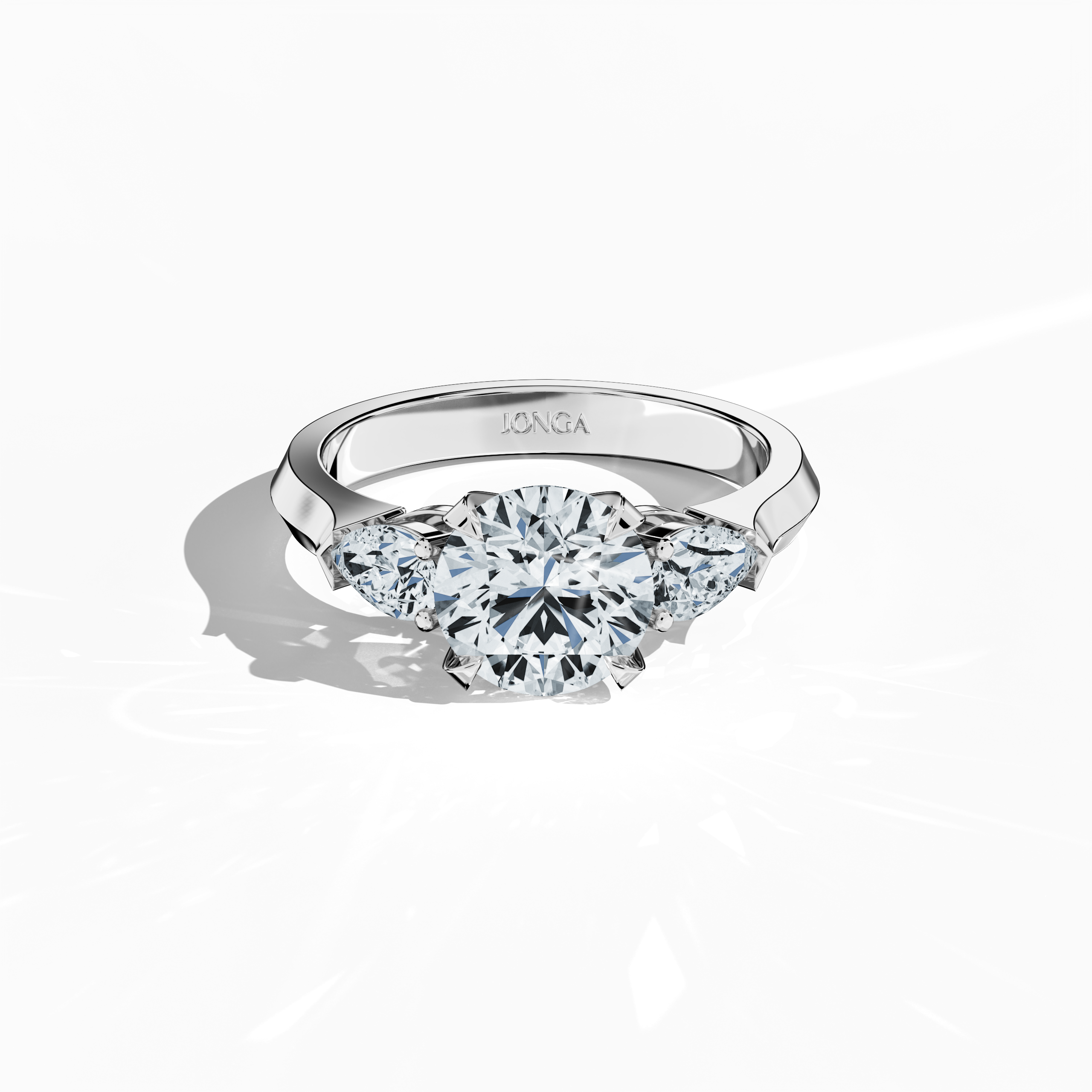 Sleeping front top view of a white gold trilogy diamond ring showcasing 2.55 ct natural diamonds—a brilliant 2 ct round center/centre diamond with two pear‐shaped side diamonds (0.55 ct total) set in a sleek band with a four‐nail prong setting. The image highlights exceptional craftsmanship and clear sparkle, ideal as an engagement ring, wedding band, or fine jewelry/fine jewellery piece. Also known as a trilogy ring, three‐stone ring, three‐diamond ring, trinity ring, and triptych ring design.