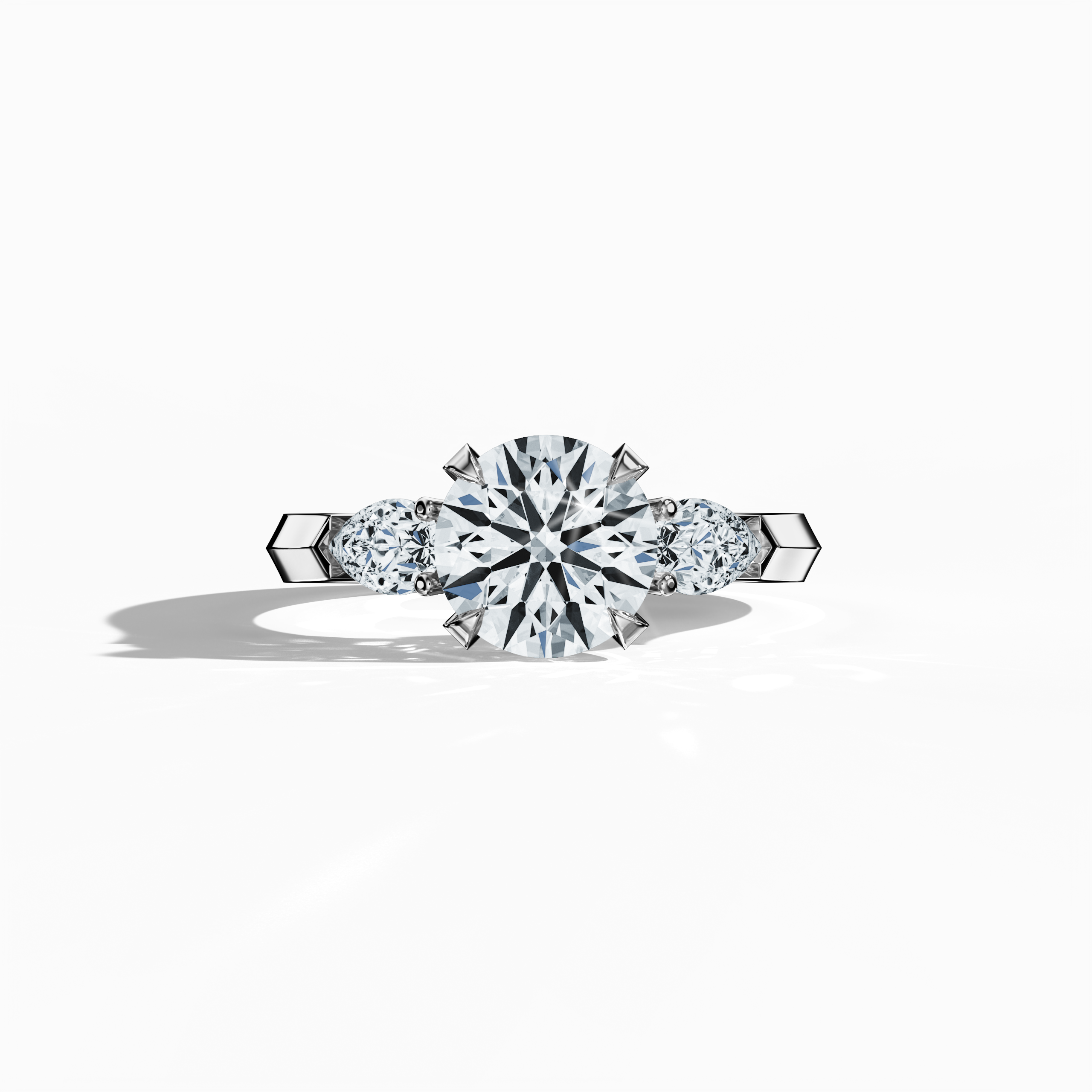 White gold trilogy diamond ring featuring 2.55 ct natural diamonds—a dazzling 2 ct round center/centre diamond flanked by two pear‐shaped side diamonds (0.55 ct total). Captured in a sleeping front view, its sleek band and refined four‐nail prong setting exude modern elegance as an engagement ring, wedding band, or fine jewelry/fine jewellery piece. Also known as a trilogy ring, three‐stone ring, three‐diamond ring, trinity ring, and triptych ring design. Keywords: white gold, trilogy diamond ring, luxury.