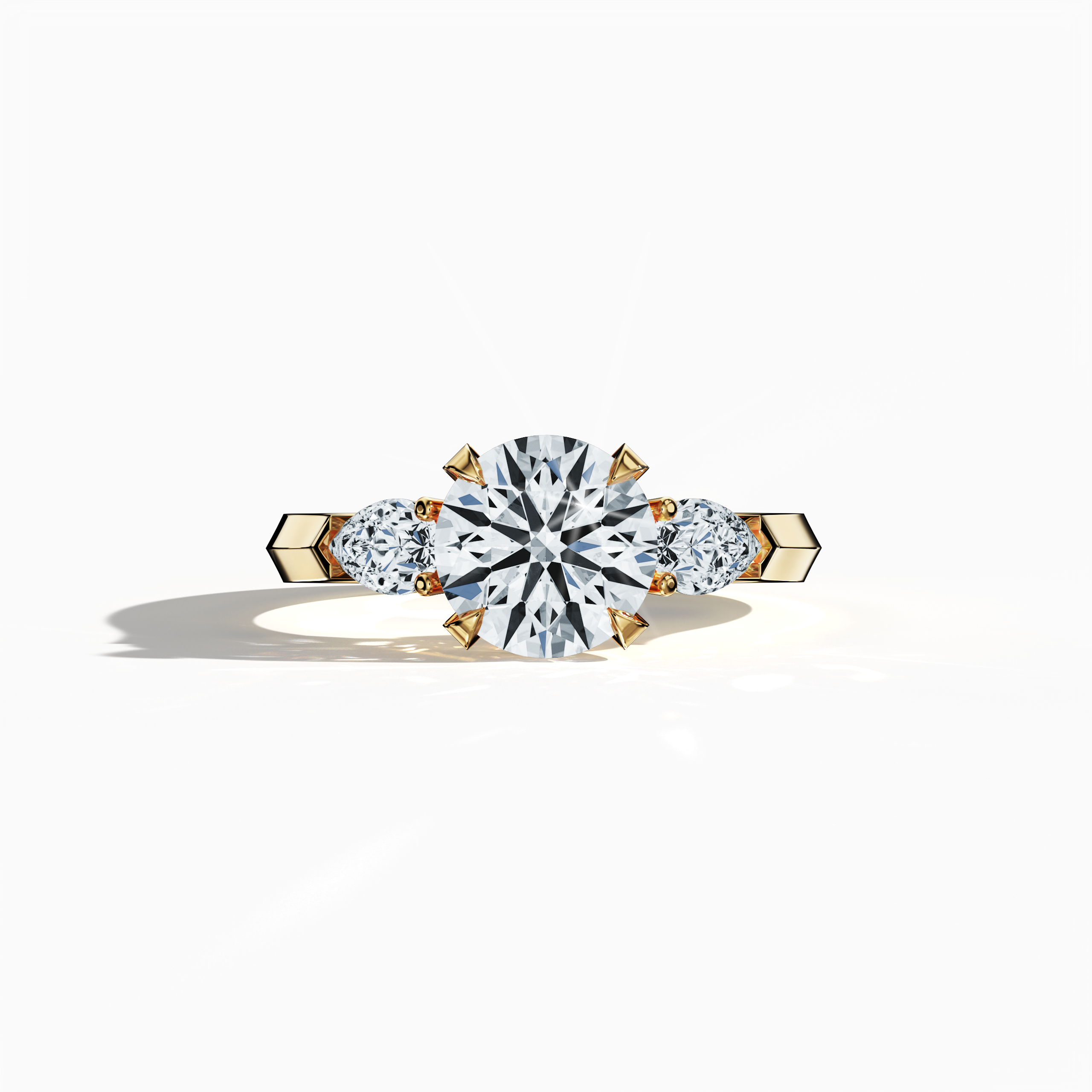 Yellow gold trilogy diamond ring featuring 2.55 ct natural diamonds—a stunning 2 ct round center/centre diamond flanked by two pear‐shaped side diamonds (0.55 ct total). Captured in a sleeping front view, its sleek band with a refined four‐nail prong setting exudes radiant warmth and sophistication as an engagement ring, wedding band, or fine jewelry/fine jewellery piece. Also known as a trilogy ring, three‐stone ring, three‐diamond ring, trinity ring, and triptych ring design. Keywords:yellow gold, radiant