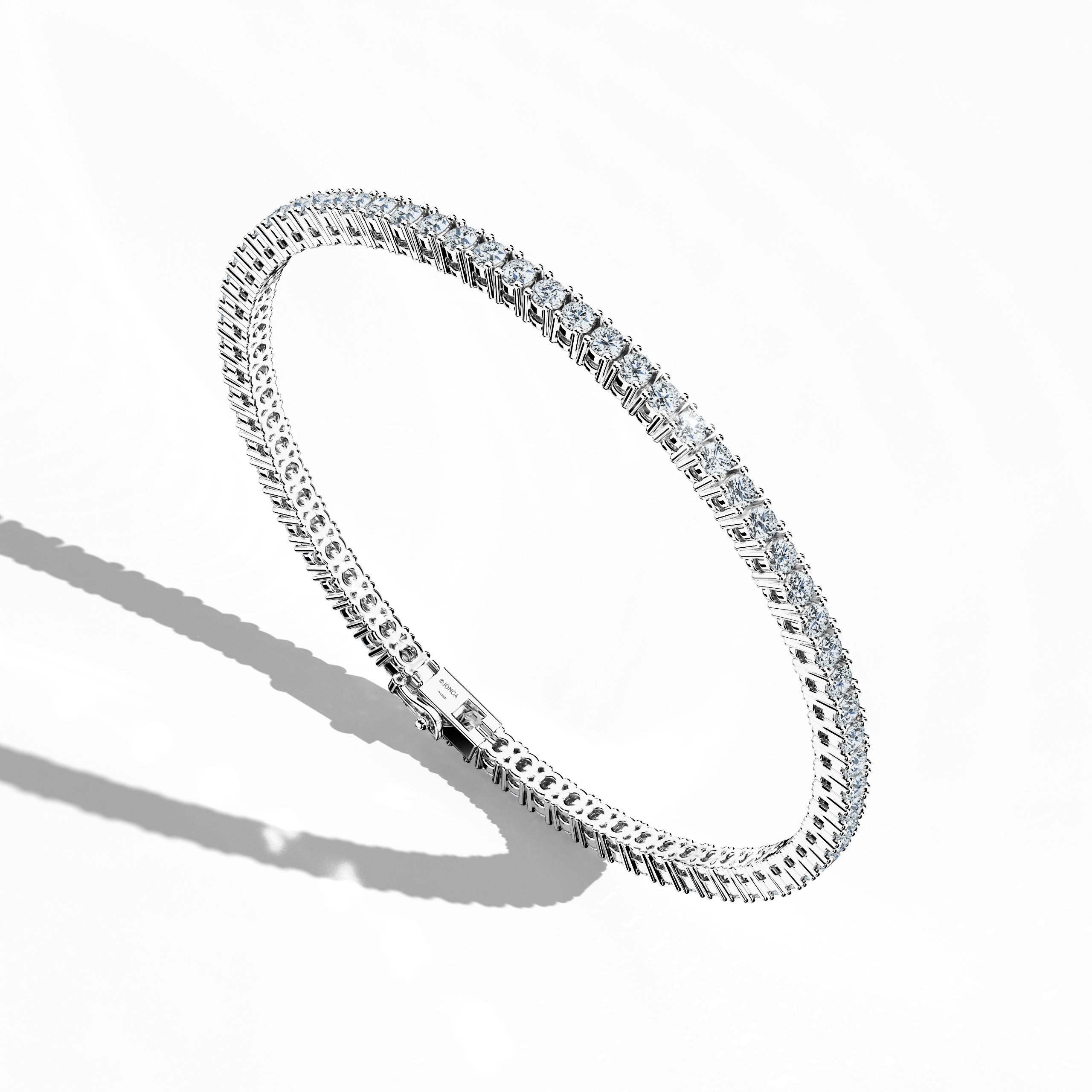 This 4-carat diamond tennis bracelet, also known as a line bracelet, eternity bracelet, river bracelet, or inline bracelet, is presented in platinum (Pt950). Seen from the side, its round brilliant stones showcase a continuous diamond line. The secure prong setting ensures lasting beauty, making it perfect for elegant events or daily wear. Keywords: diamond tennis bracelet, platinum, line bracelet.

