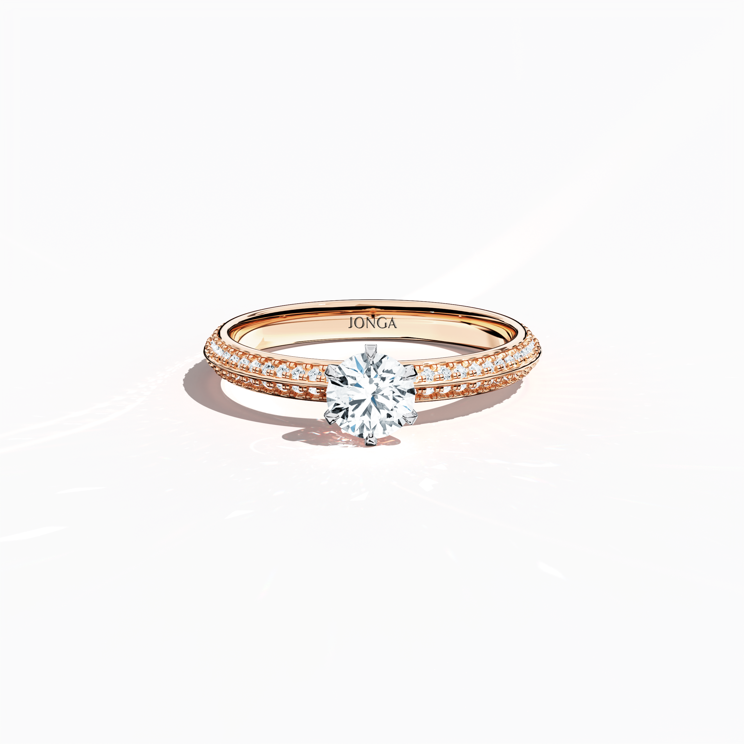 Elegant 0.90  карат diamond ring in a six‑prong setting with a pavé band – including a 0.50  карат center diamond and 0.40  карат side stones – rendered in soft розовое золото (blush/pink gold) with a dual‑tier, step‑accented band and a defined central line. Captured from a front top view, this fine Украшения/fine Ювелирные изделия ring highlights its luminous pavé setting and gentle, romantic finish.