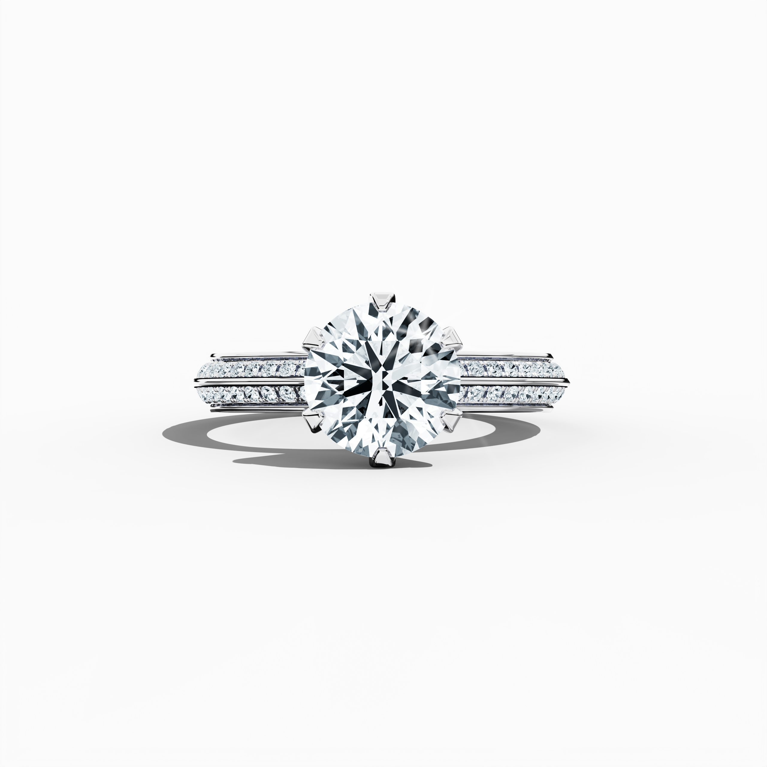 Solitaire paved ring with a total of 2.40 ct diamonds—featuring a 2 ct center diamond and 0.40 ct pavé side stones—set in a bright white gold band with a modern two‑step design and a sharp central line. Shown in a sleeping front view on a flat surface, this fine jewelry/fine jewellery ring radiates sleek sophistication and luminous brilliance.