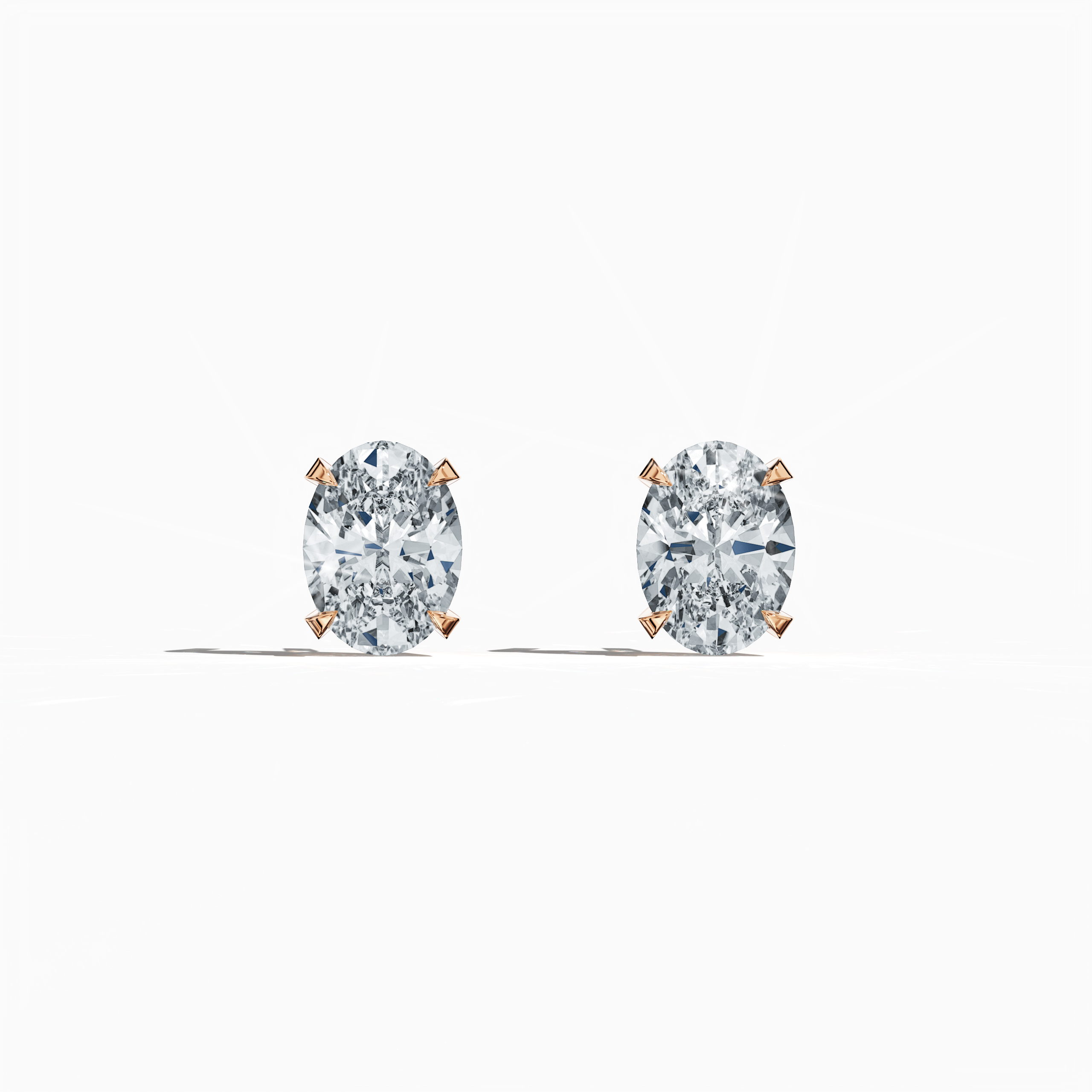 Front view of 1-carat natural diamond earring in 18k розовое золото with nail prong setting; features an oval cut diamond (also known as oval brilliant or elongated oval in some regions) – luxury fine Украшения/fine Ювелирные изделия ear accessory.