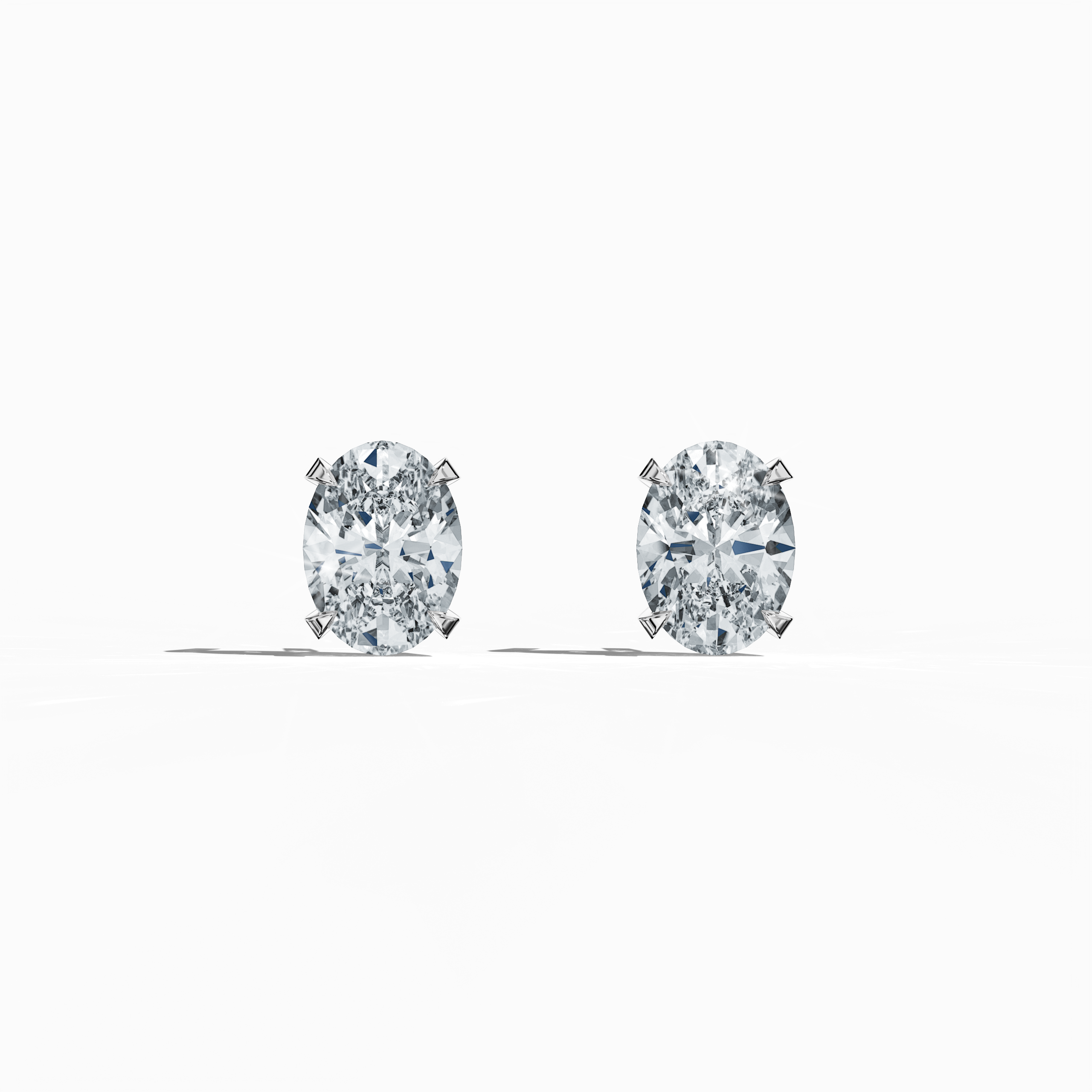 Front view of 1-carat natural diamond earring in 18k белое золото with nail prong setting; features an oval cut diamond (also known as oval brilliant or elongated oval in some regions) – luxury fine Украшения/fine Ювелирные изделия ear accessory.