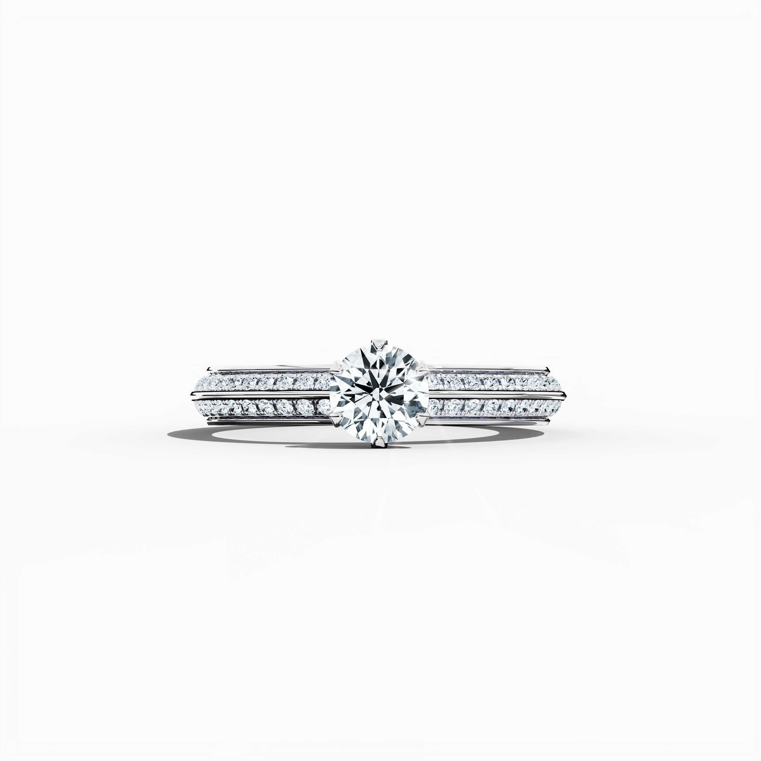 Solitaire paved ring with 0.90ct total diamonds – featuring a 0.50ct center diamond and 0.40ct pavé side stones – set in a bright white gold band with a modern two‑step band design and a sharp central line. Shown in a sleeping front view on a flat surface, this fine jewelry/fine jewellery piece radiates sleek elegance and luminous sophistication.