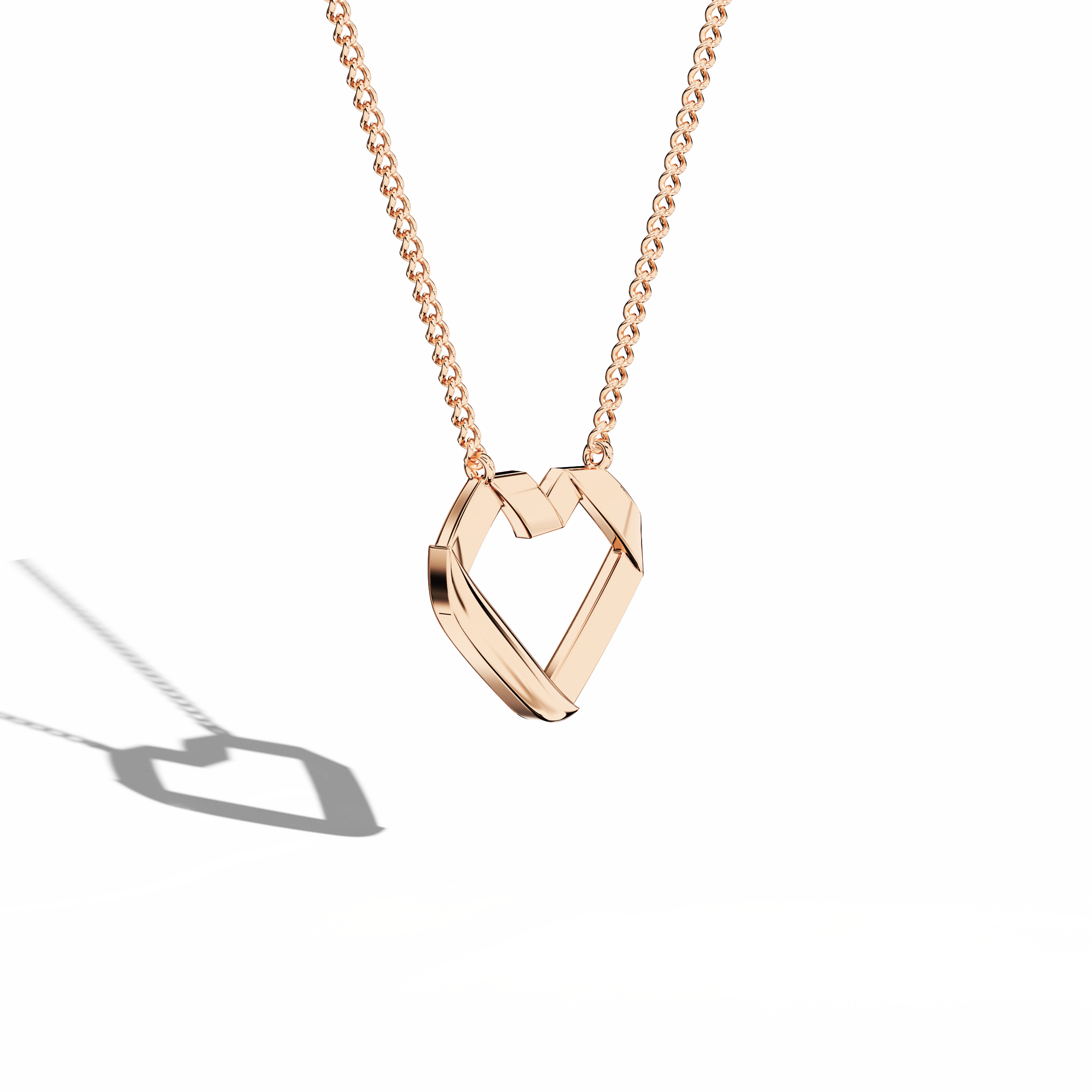 Angled top perspective highlighting a refined open-heart Украшения (Ювелирные изделия, joias, bijoux, gioielli, schmuck) creation in розовое золото (oro rosa, or rose, Roségold). Labeled as a heart-pendant, heart necklace, love pendant, collier cœur, colgante de corazón, pendentif cœur, collana cuore, or Halskette Herz, it boasts sleek geometry and a luminous blush finish. The polished surface captures light, accentuating its modern allure. Keywords: heart-pendant, розовое золото, Украшения.